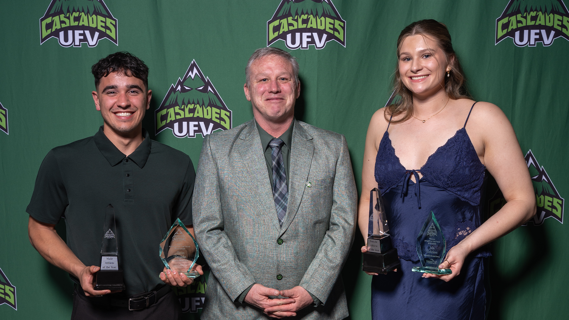 Mateo Brazinha and Julia Tuchscherer with UFV President James Mandigo for the Athlete of the Year Awards