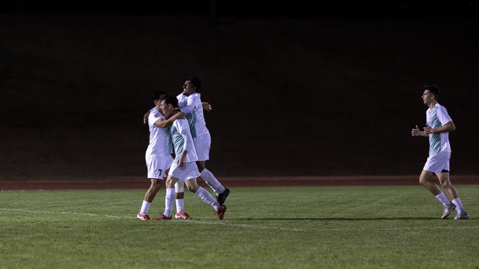 The Cascades celebrate Spencer Mellett's goal against UNBC