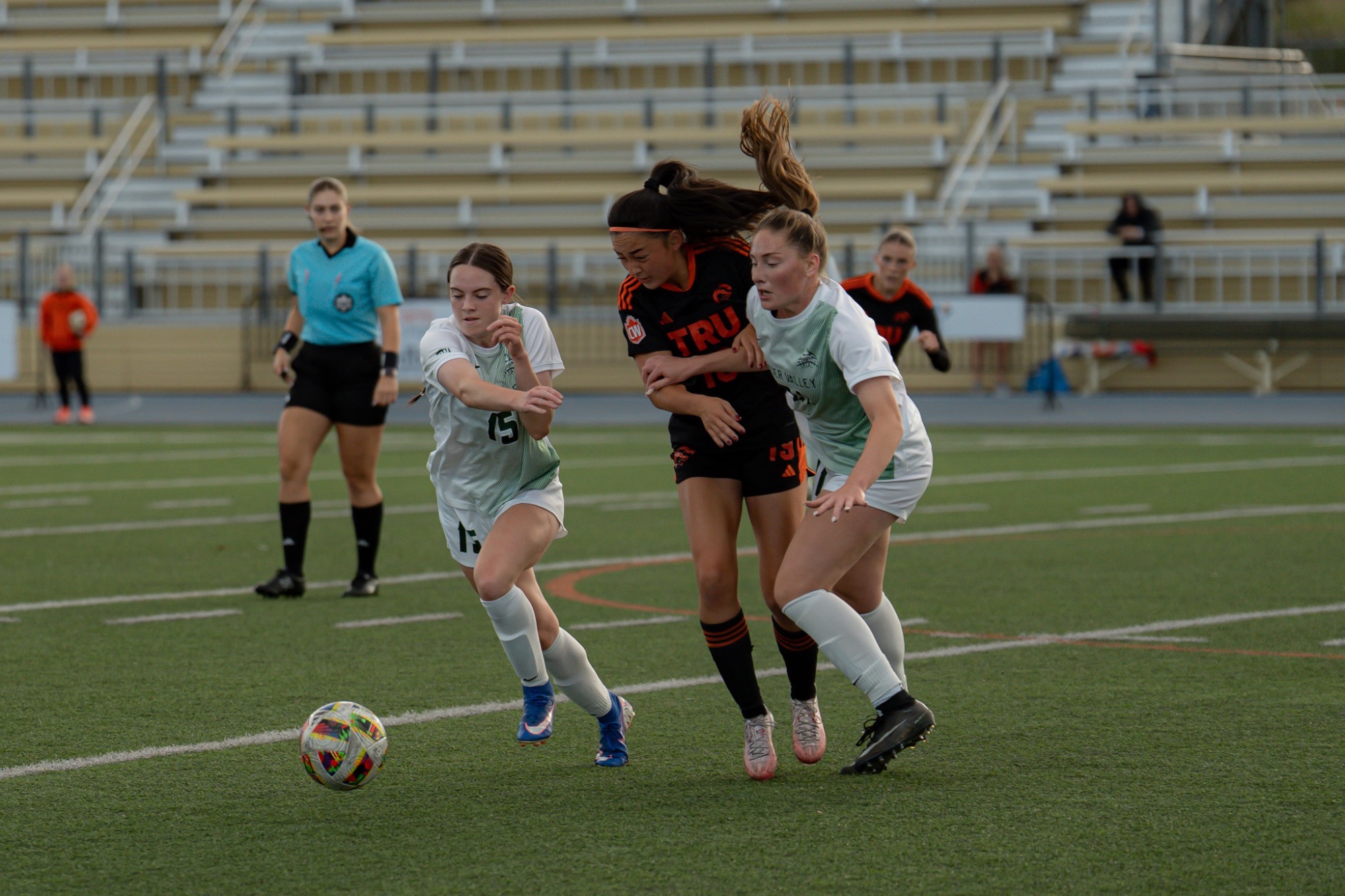 Kyla Kerr and Catie Cameron defend vs TRU - shot by SydneyLynnPhoto / Sydney Neilson-Anderson