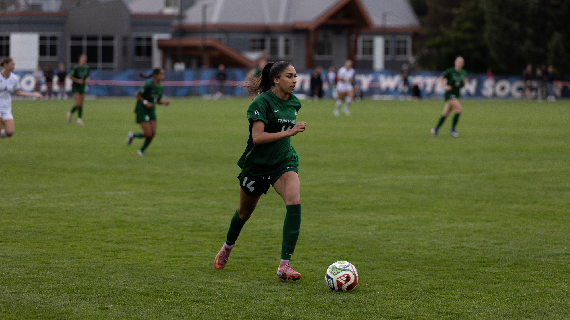 Rayna Lally runs with the ball in her first game as a Cascade