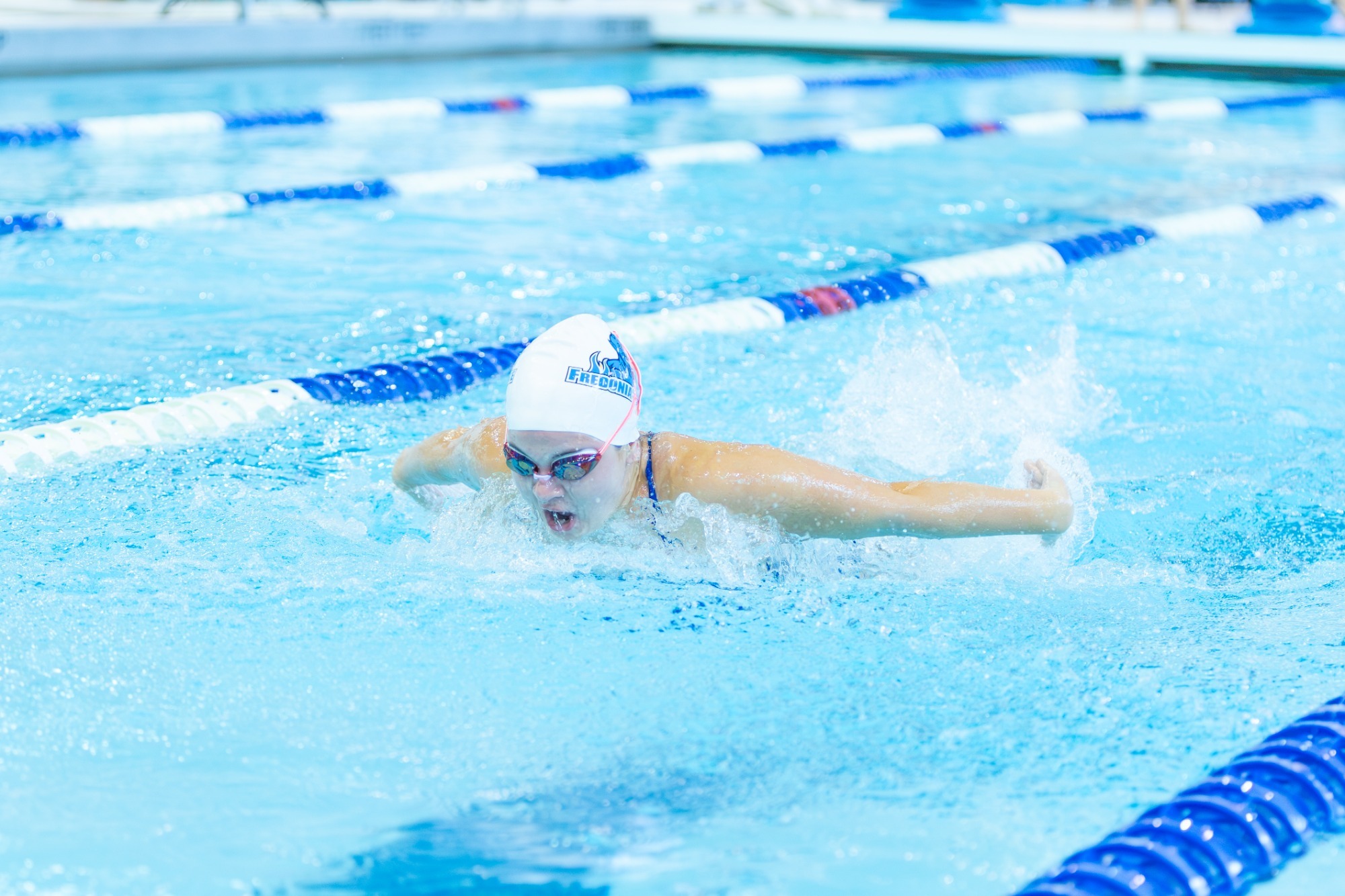 Women's swimming action photo against Pitt-Bradford
