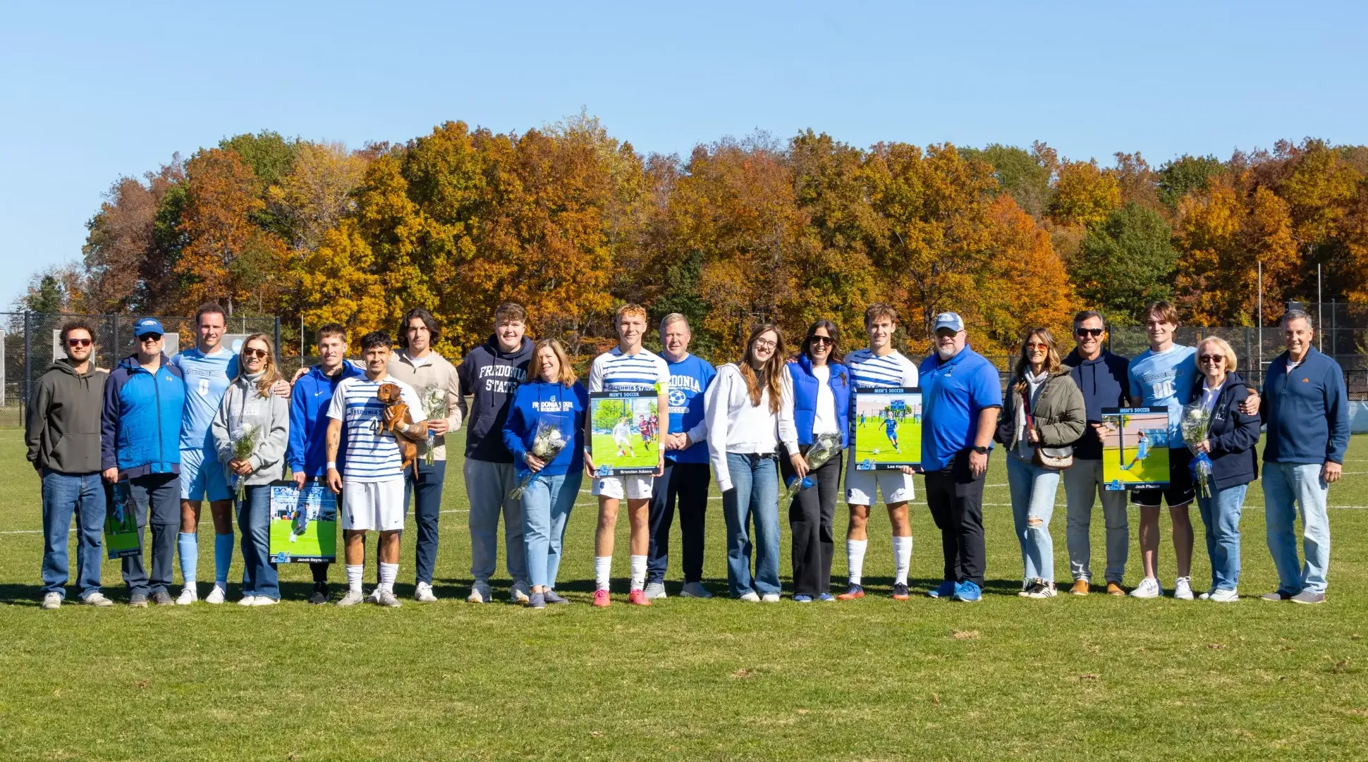 Group photo of Fredonia State Men's Soccer Seniors and their families on Senior Day.