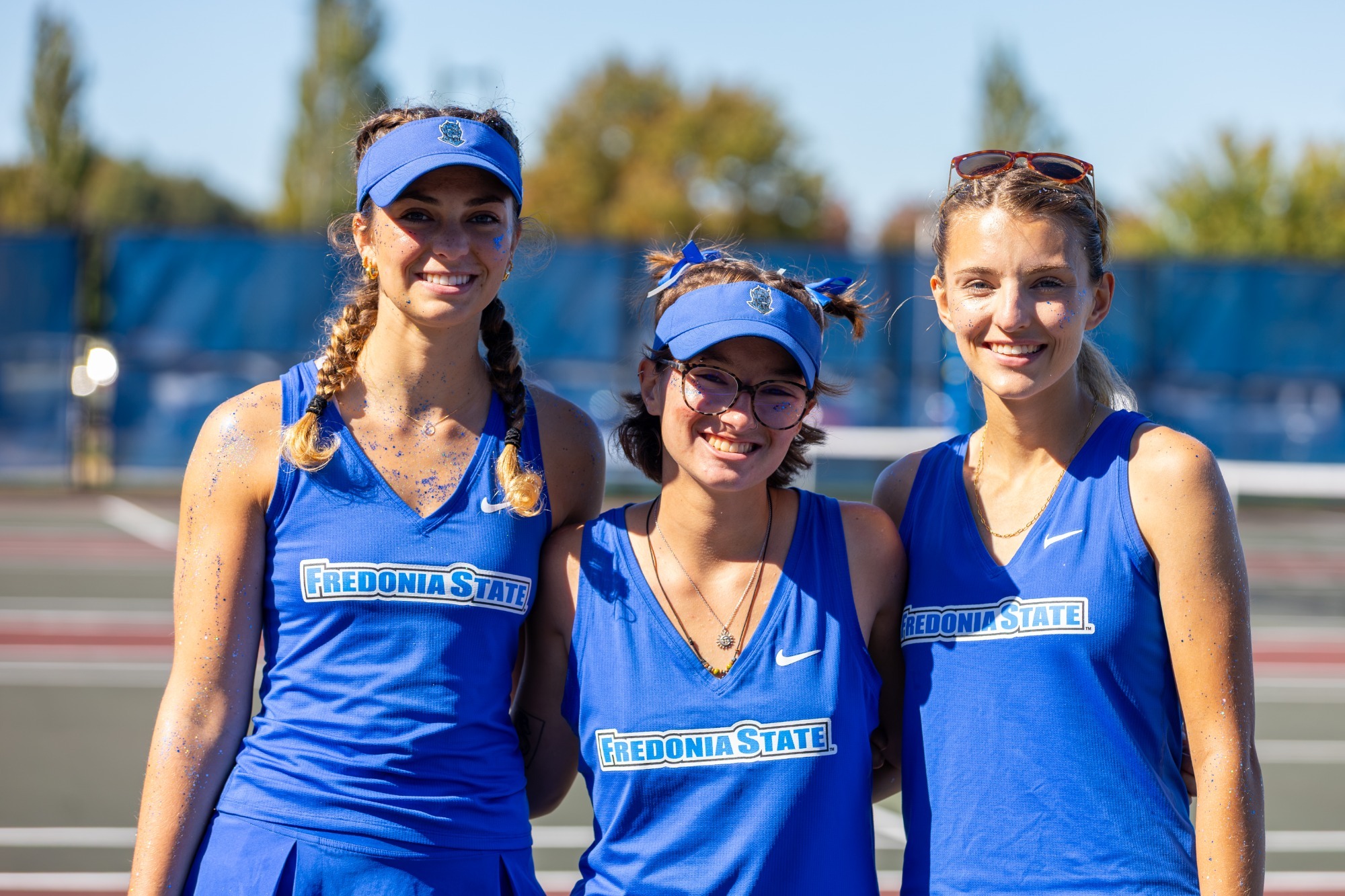 Fredonia State women's tennis seniors Lucy Prevet, Gabbi Farr and Rylyn Tunstall pose for a group photo