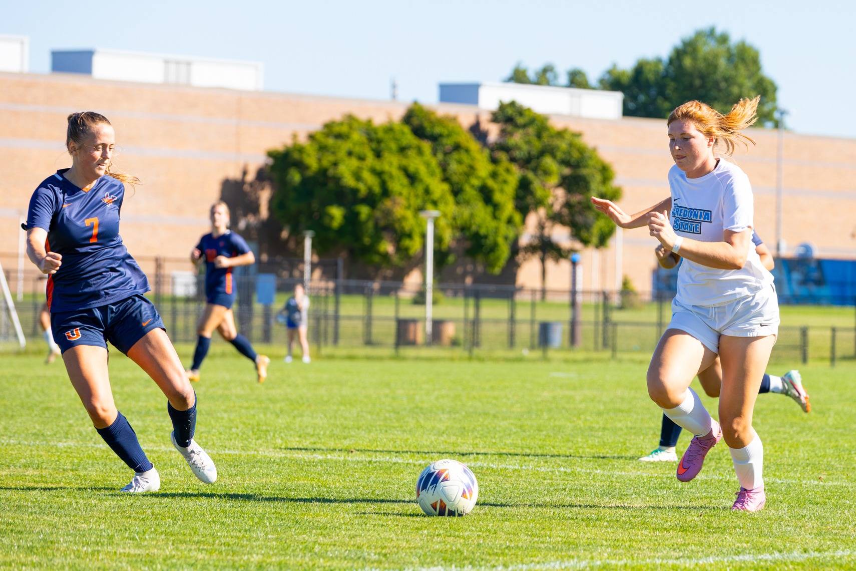 Abby Herbst dribbles the ball downfield for Fredonia State women's soccer
