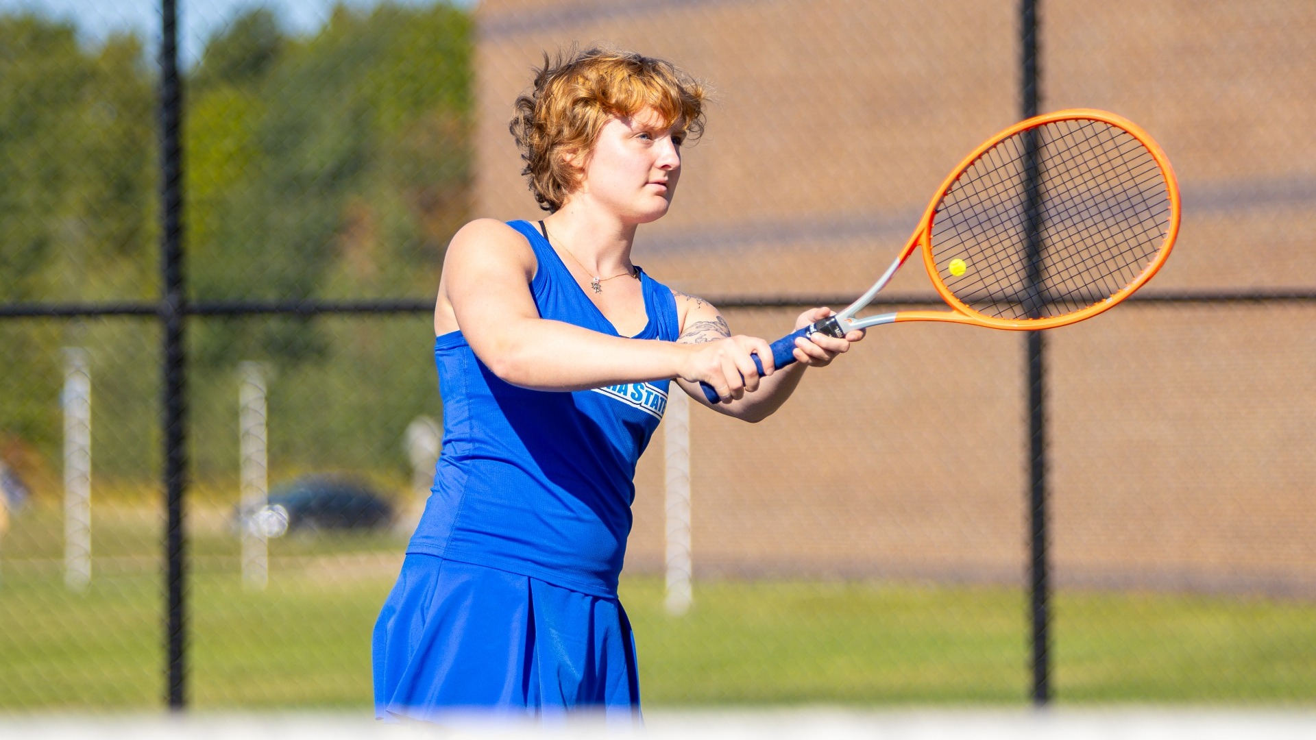 Amelia Stathatos returns a serve 