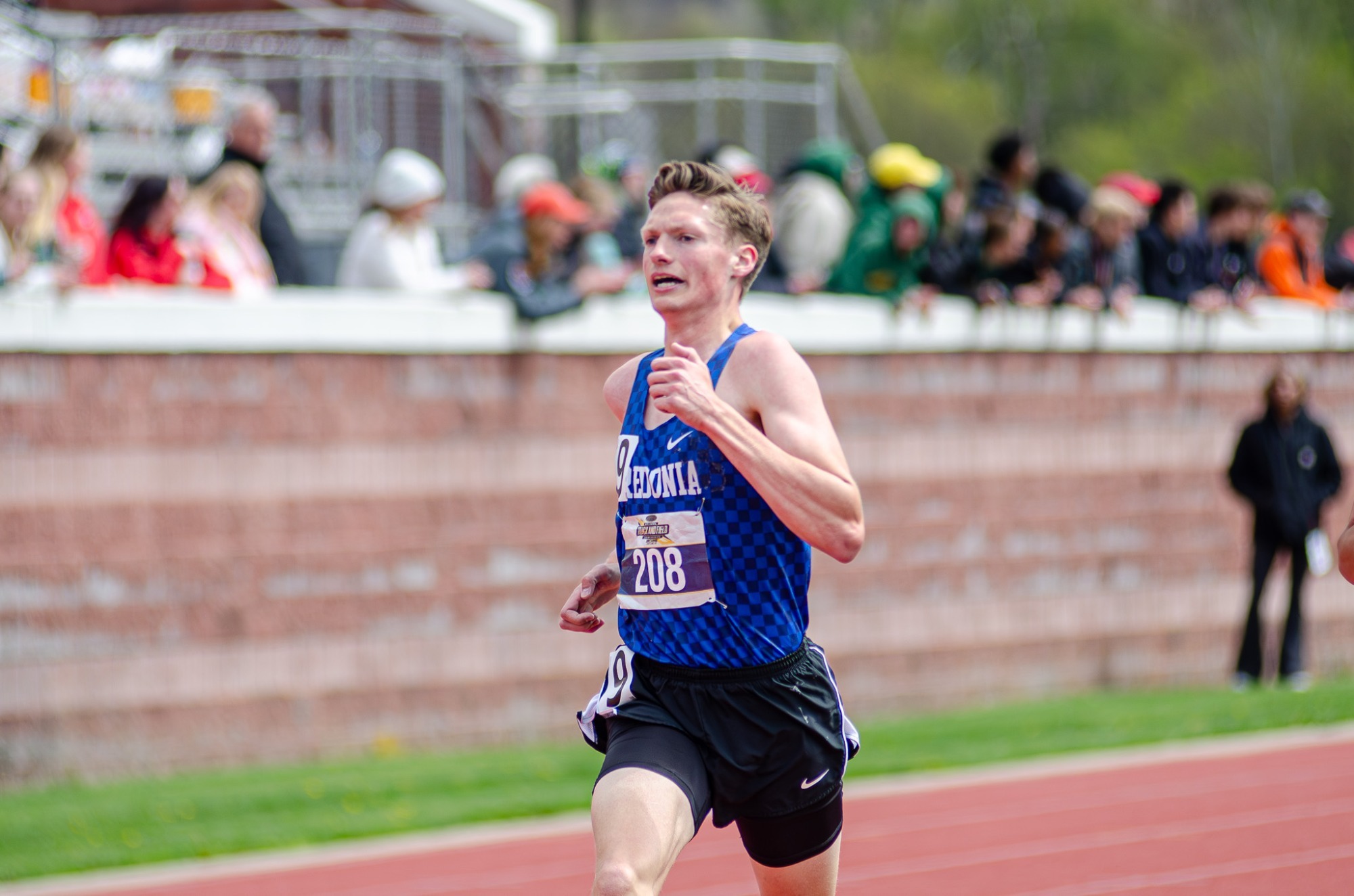 Stephen Hallberg Running to Secure Gold in the 5000m