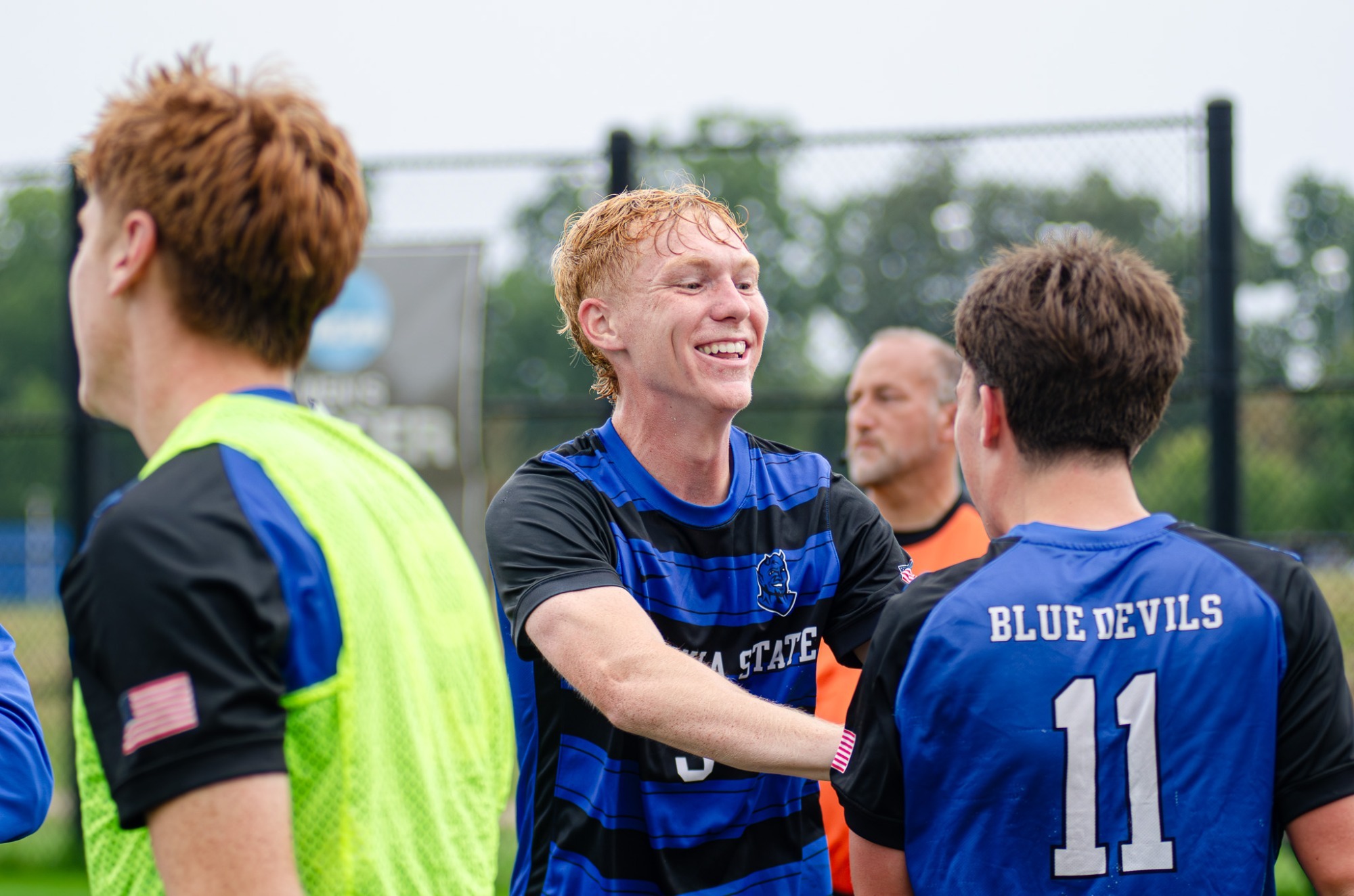 Brendan Adams of Fredonia State men's soccer celebrates with teammates