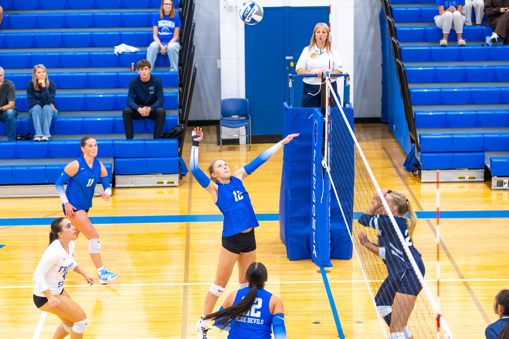 Donnilyn Sheldon attacks the net versus Geneseo