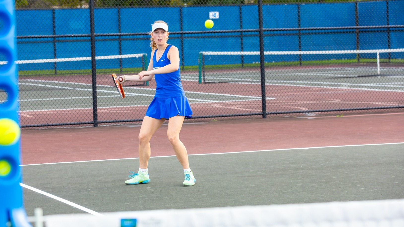 Allison Bartoszek makes a forehand return 