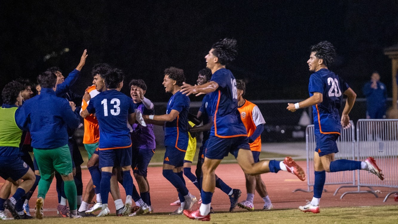 mens soccer celebrating