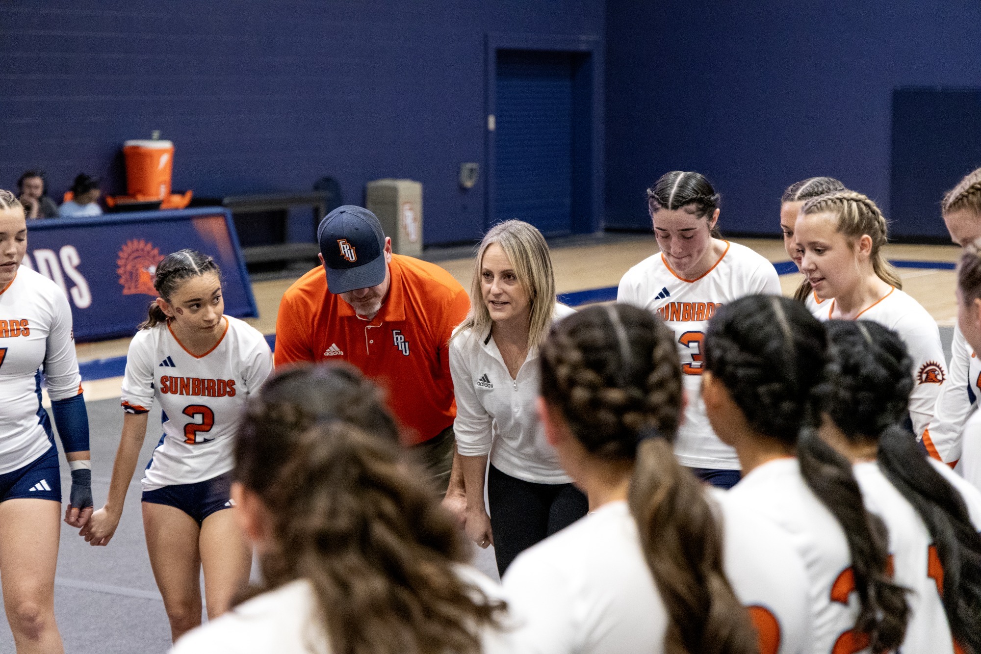 stunt in huddle before match
