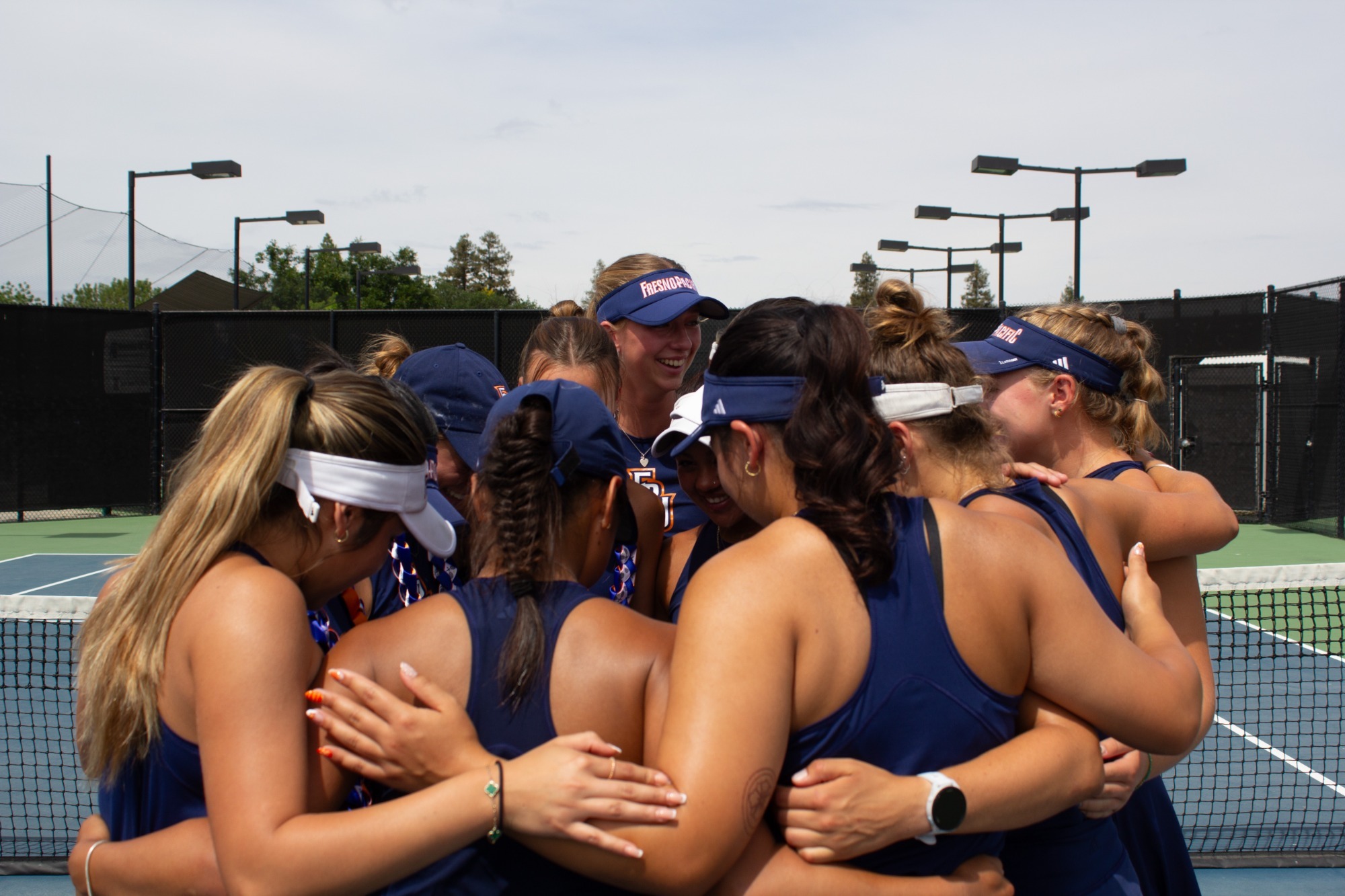 womens tennis in senior day huddle