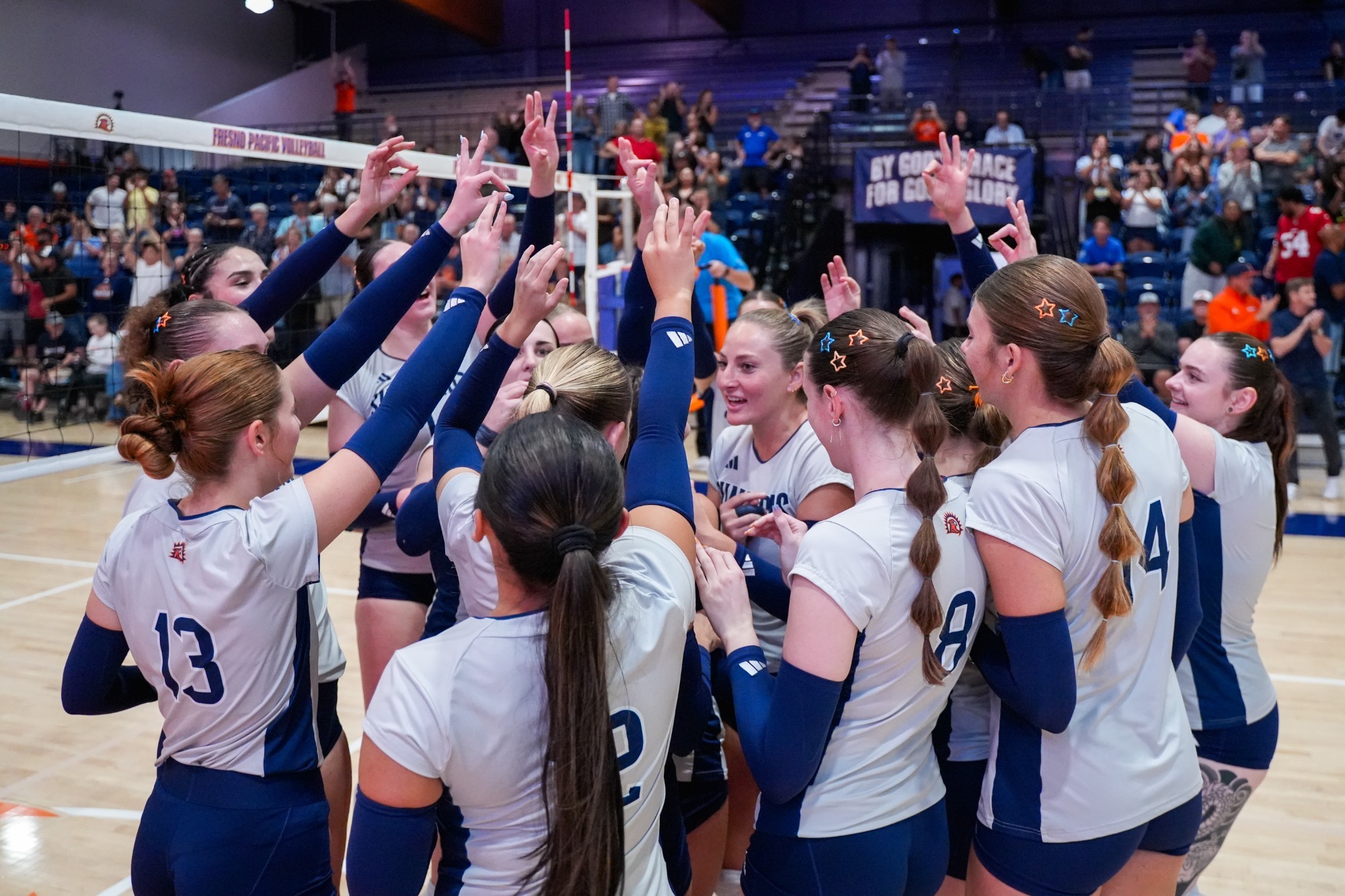 womens vb celebrating the win over CSUSB