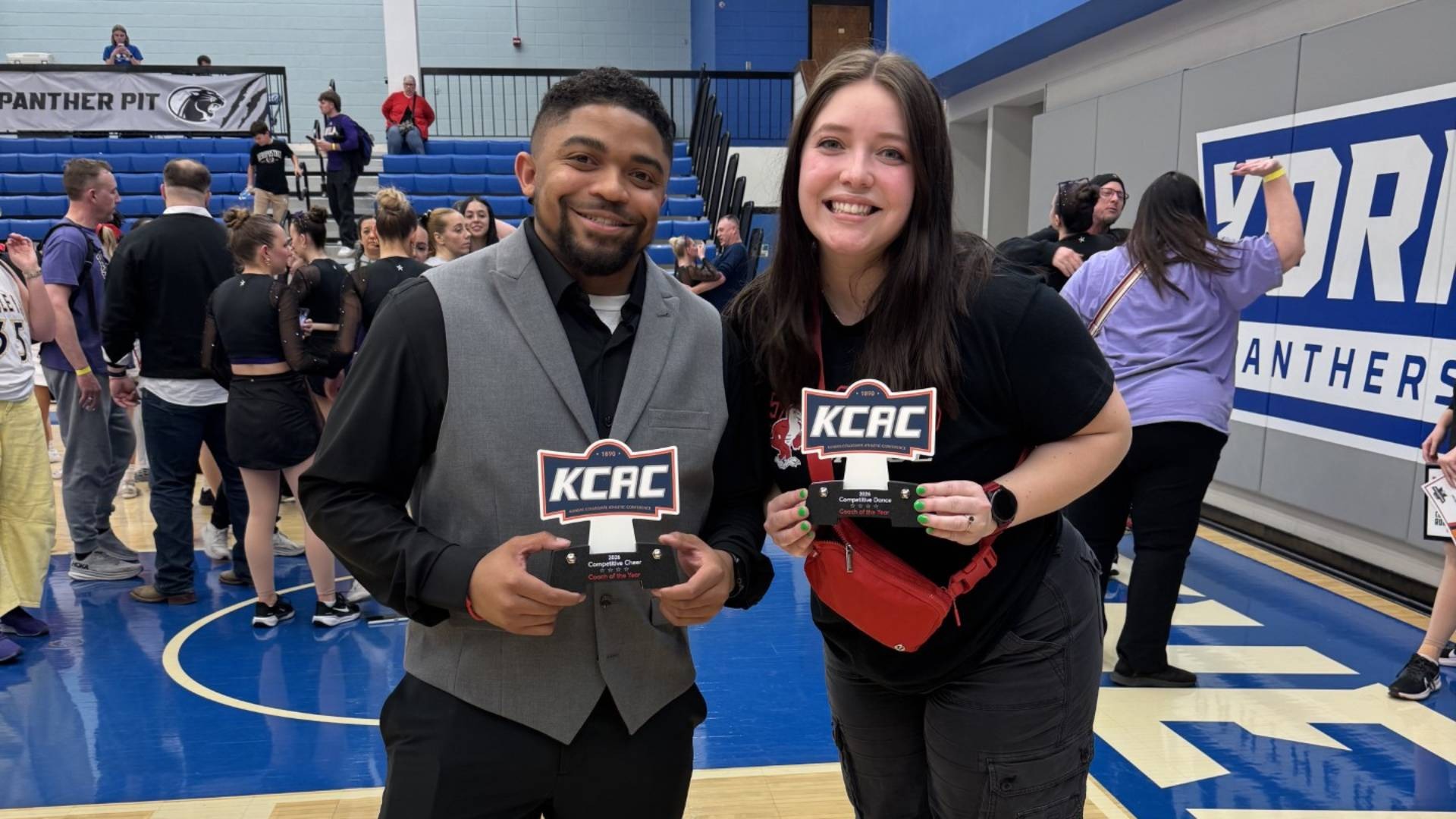 Joshua Johnson and Taylor Stuchlik KCAC Coach of the Year action web