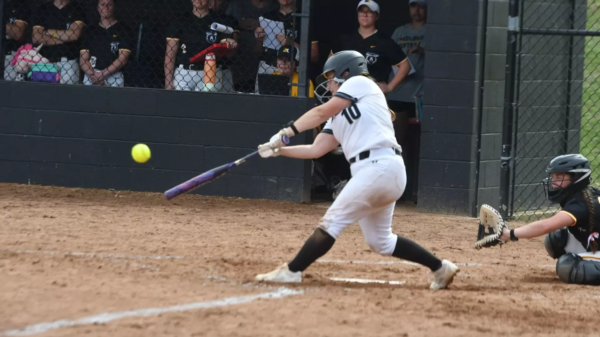Frostburg Softball player, number 10, Kylee Piconi, swinging bat at home plate versus West Liberty.