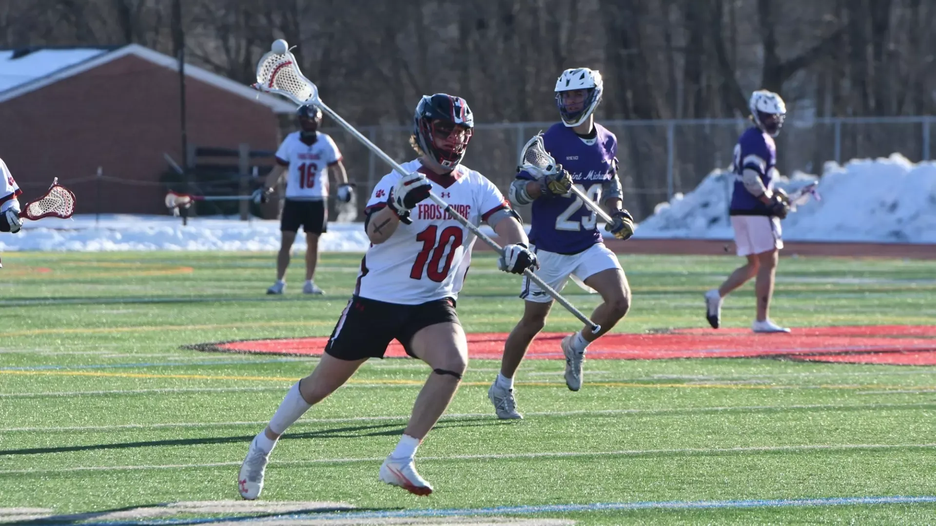 Frostburg men's lacrosse player, number 10, Matt Williams passing the ball.
