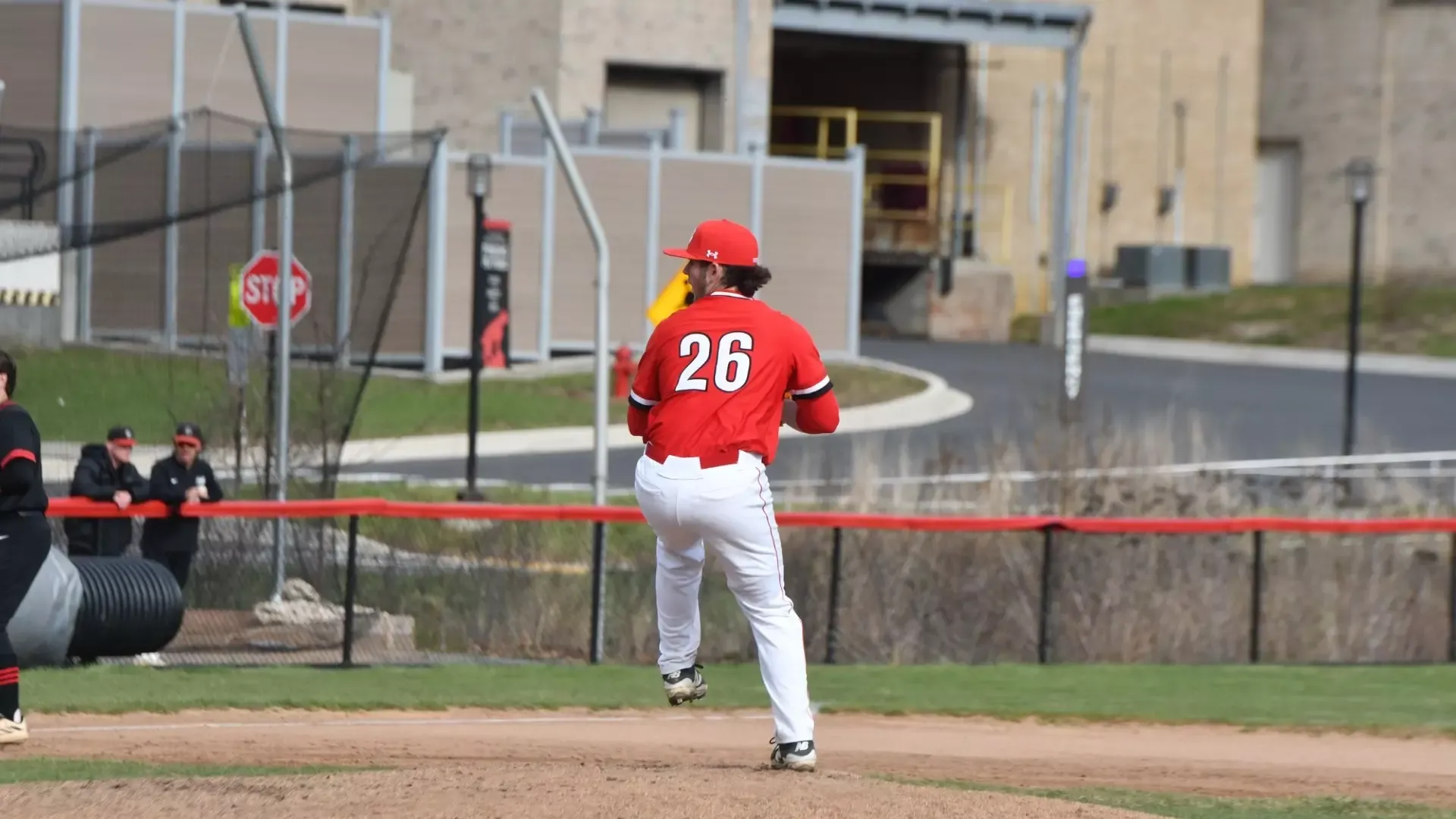 Frostburg baseball pitcher, number 26, Bryce Bauer, wind up to pitch.