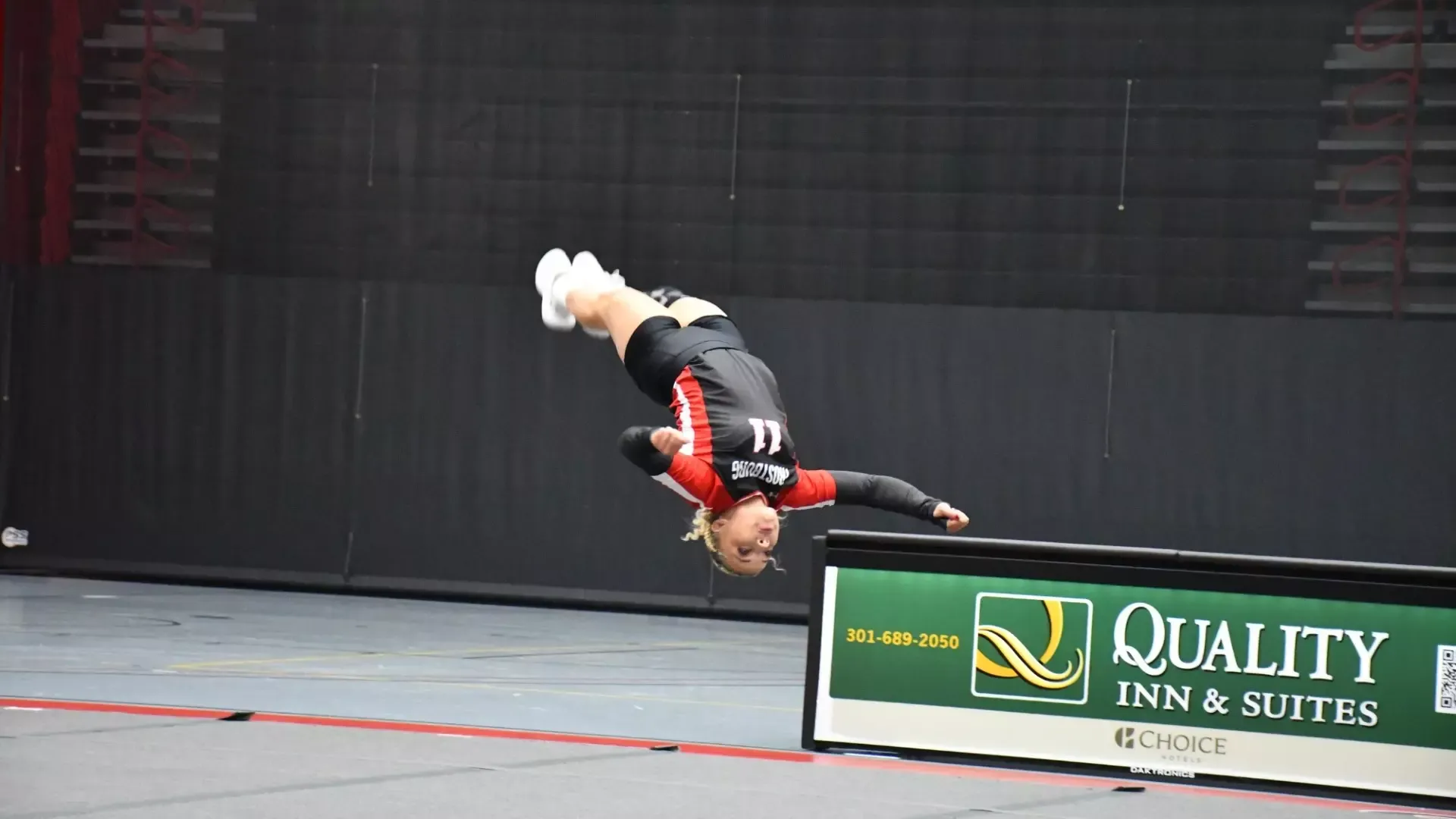 Frostburg Acro and Tumbling, number 11, Nayramis Rodriguez-Lugo, flipping during tumbling event.