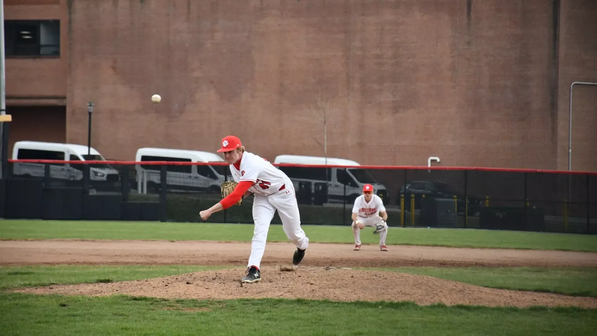 Frostburg Baseball pitcher, number 41, John Smith, throwing pitch at mound. 