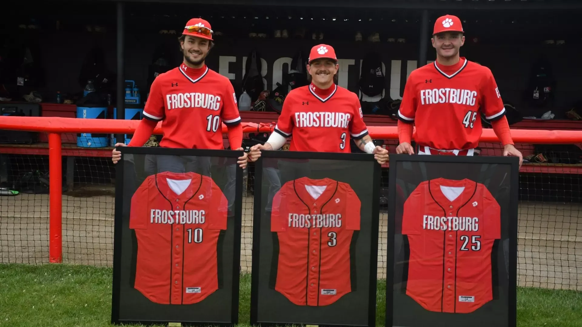 Frostburg baseball seniors, left to right, each holding plaques with their jerseys, number 10, Jake Holler, number 3, Tiernan Daly, number 45, Ty Morris.