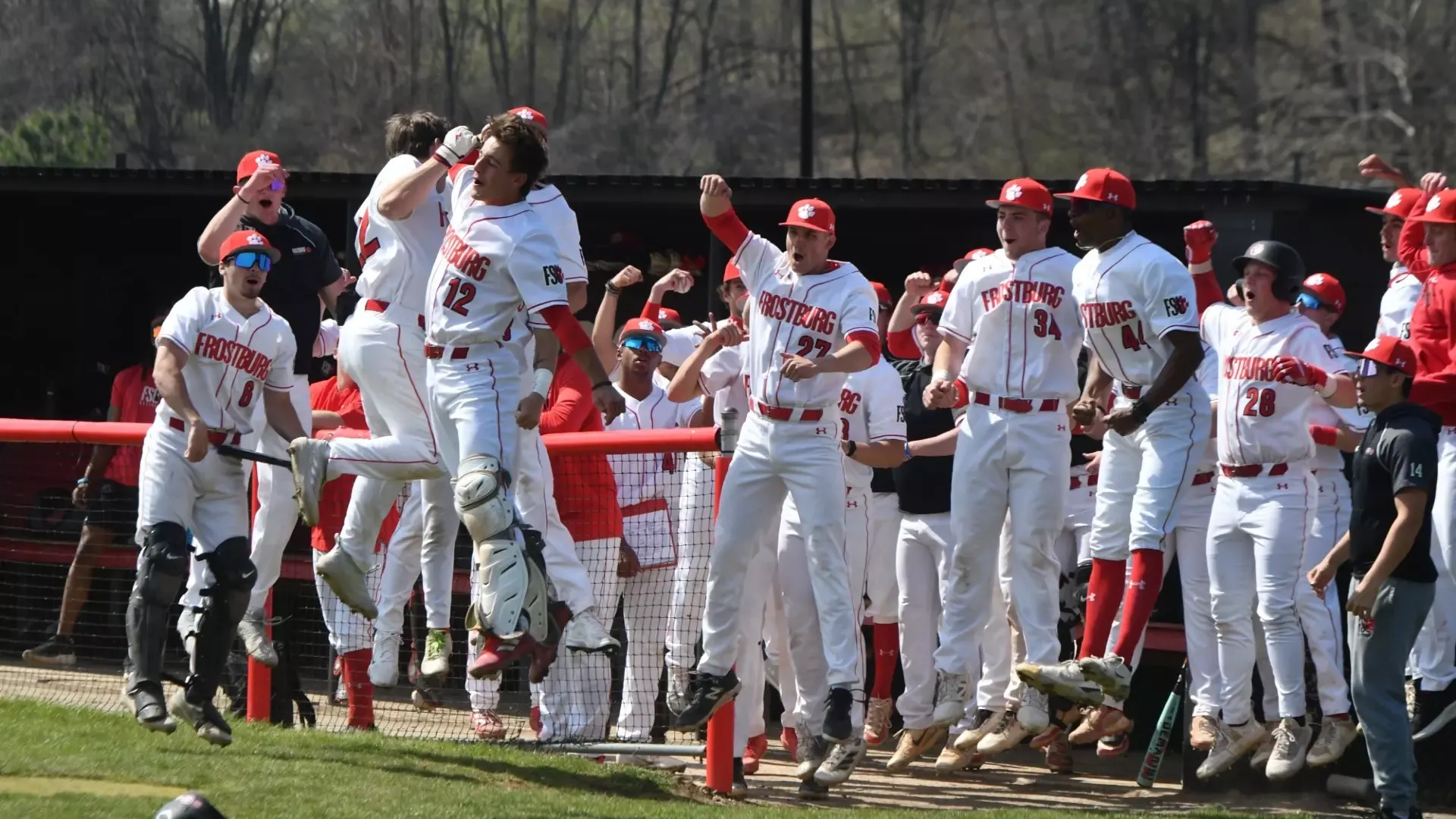 Frostburg baseball team celebrates during West Virginia Wesleyan game.