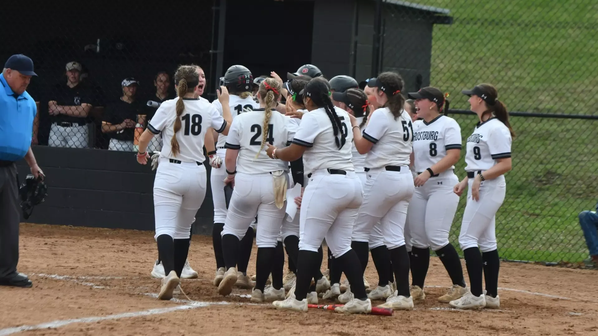 Frostburg softball team huddle versus West Liberty.