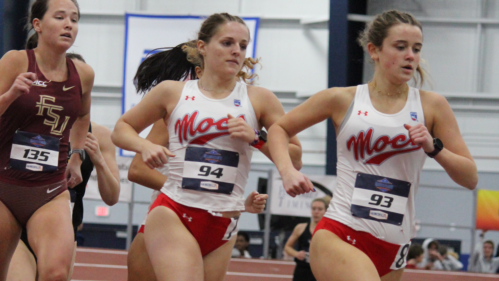 Grace Reed and Emma Pfeiffer compete in the mile at the Jimmy Carnes Invitational