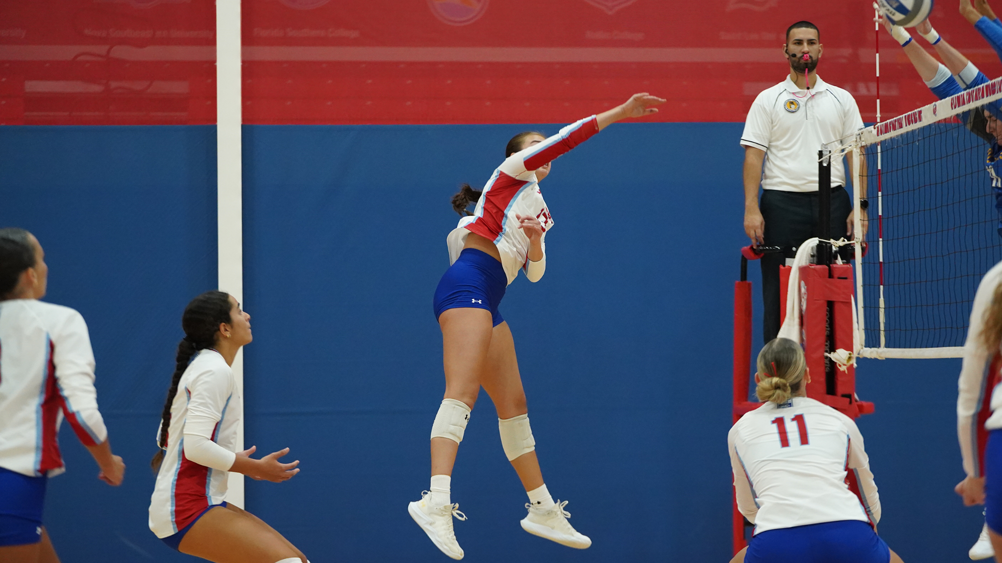 Chloe Moreland attacks the ball versus Rollins