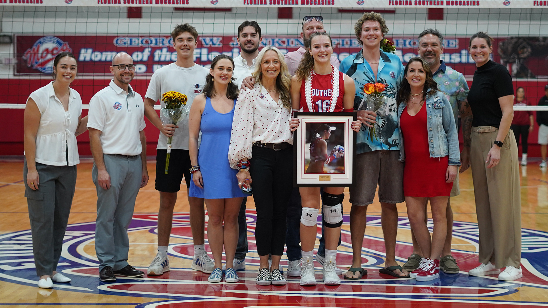 Morgan Word with friends and family and the FSC coaching staff on Senior Day