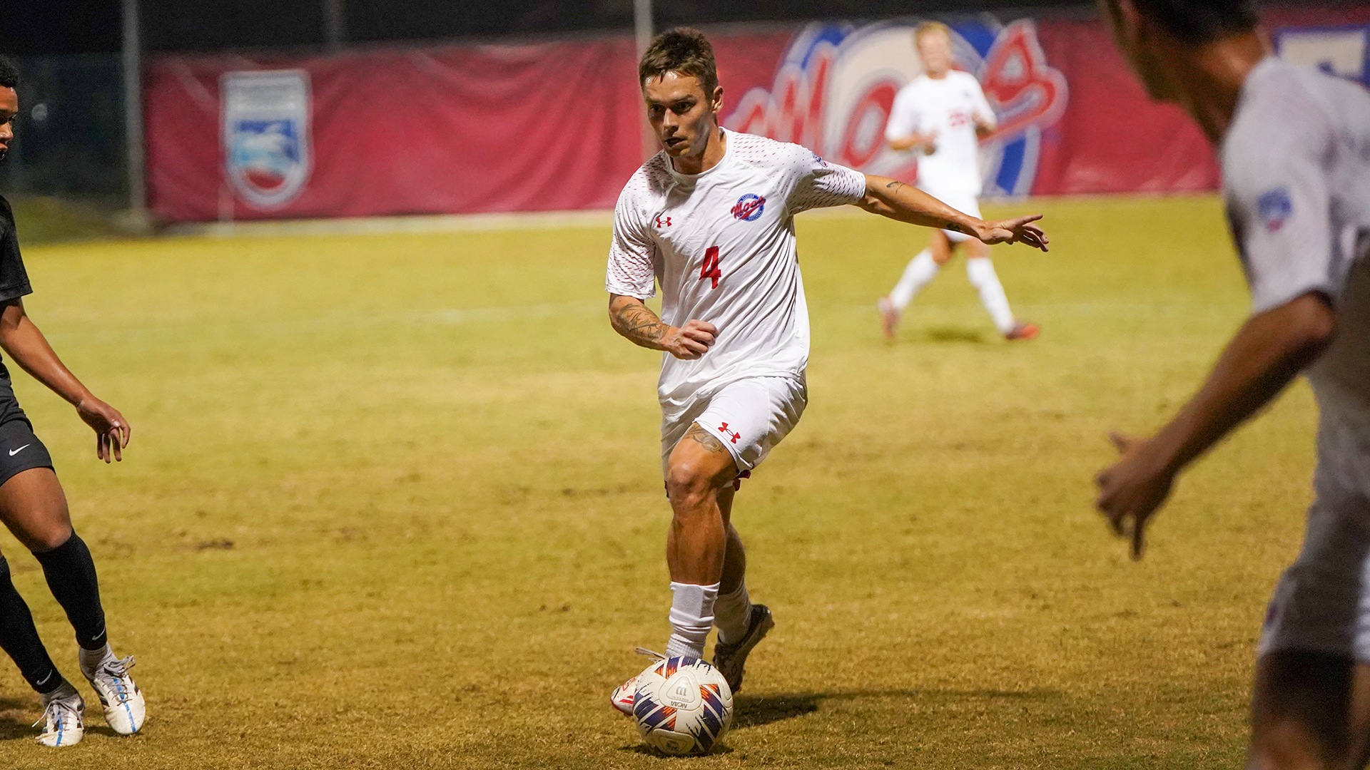 Chandler Crawshaw dribbling the ball down the field