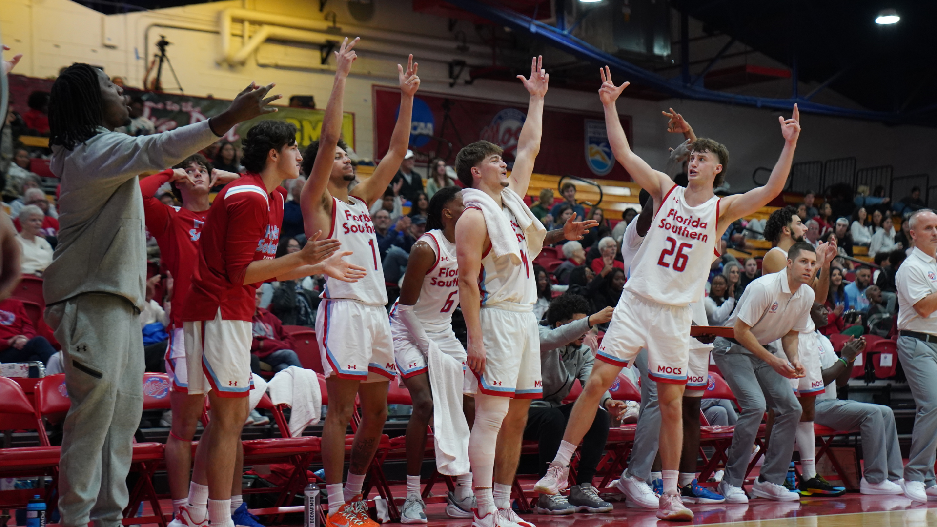 Men's basketball bench celebration against Lincoln