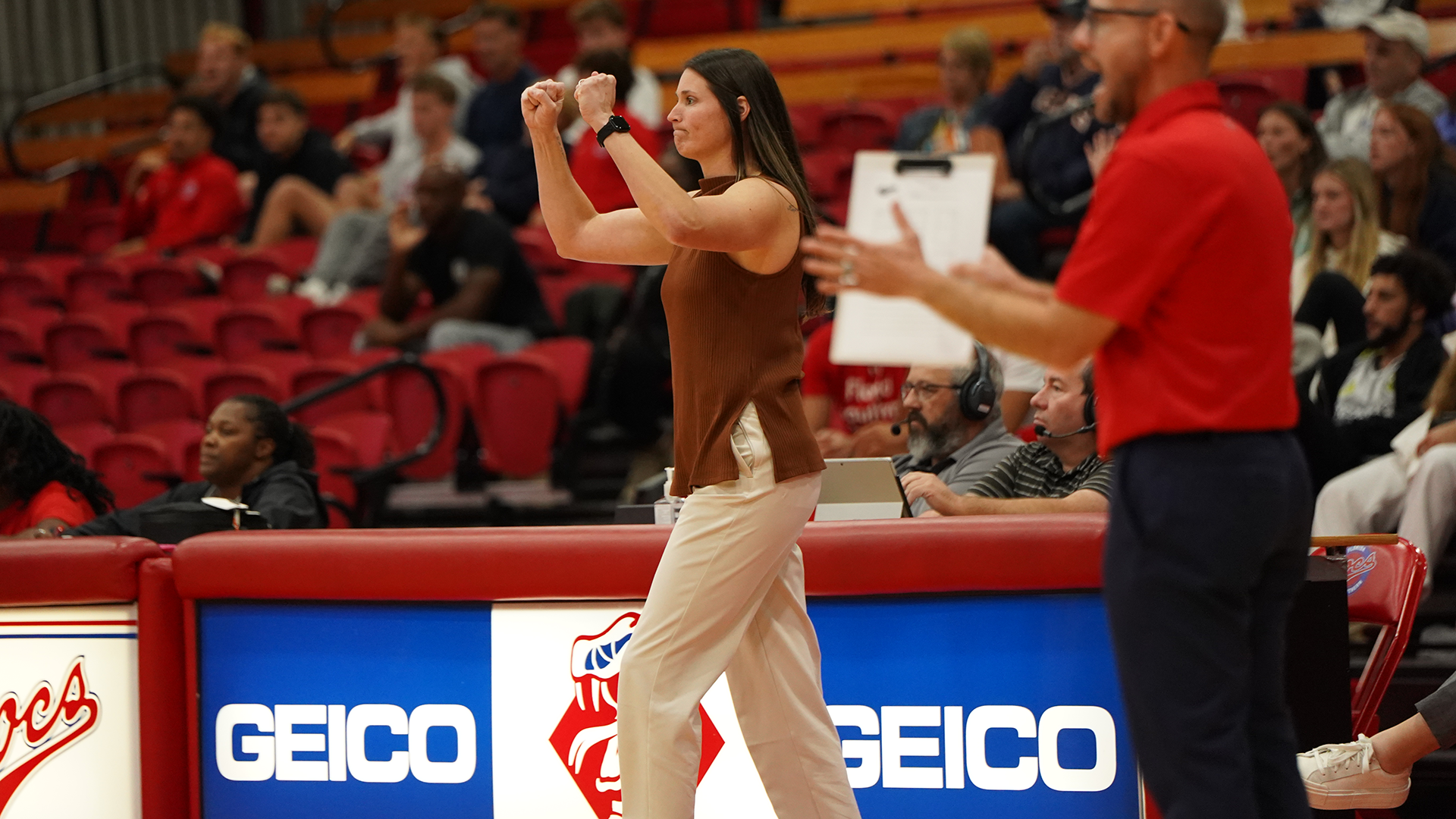 Head Coach Ashlee Crowder celebrates a point for FSC Volleyball