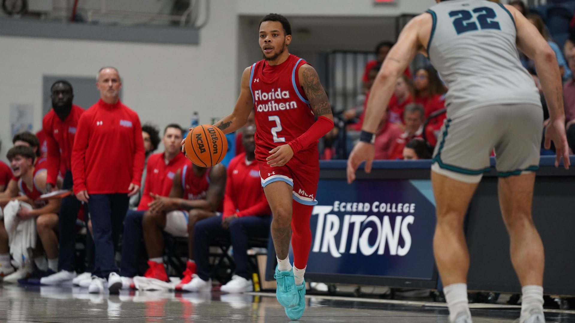 Jasir Tremble dribbles ball against Eckerd