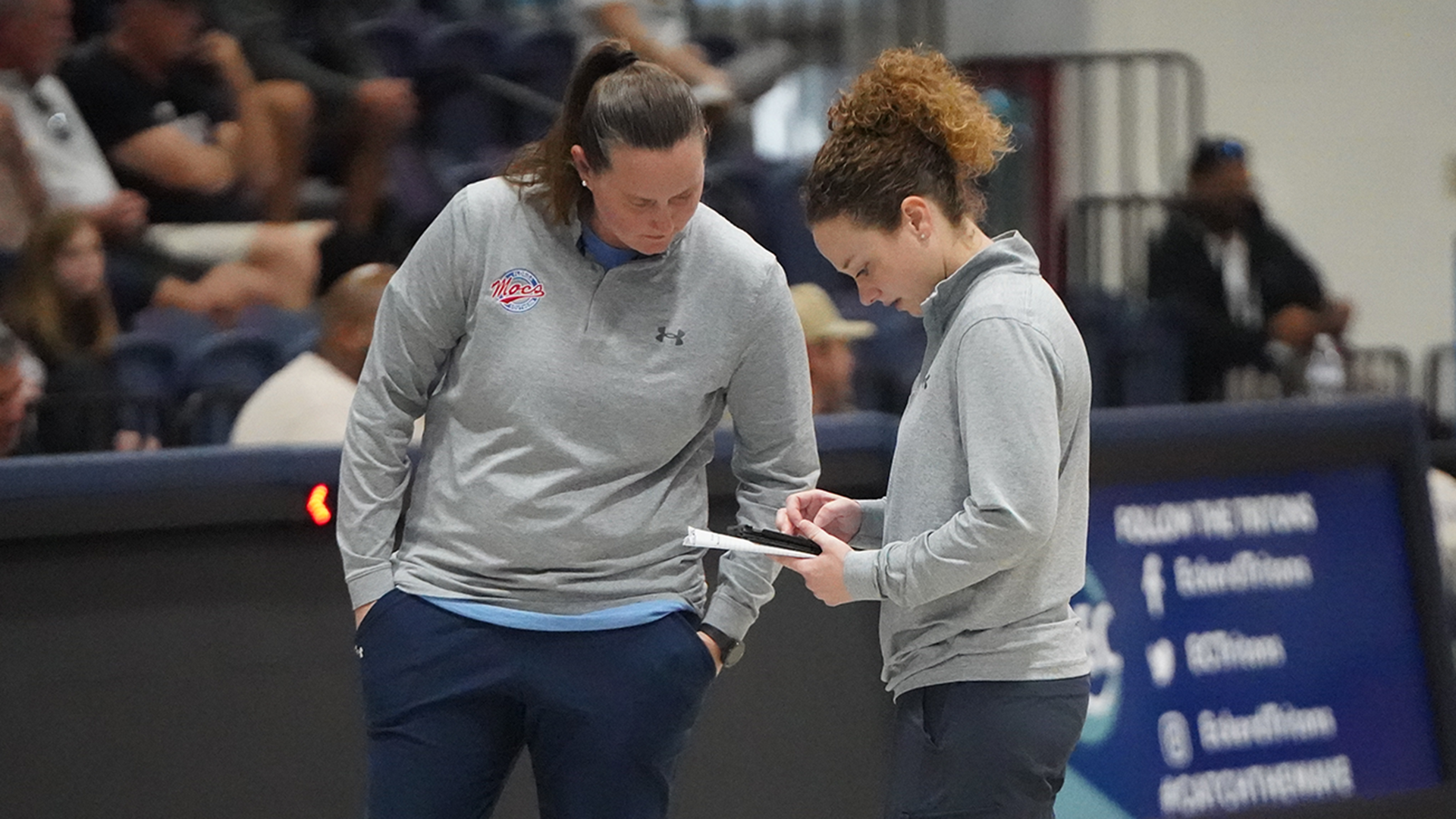 Megan and Shelby discussing a play at eckerd