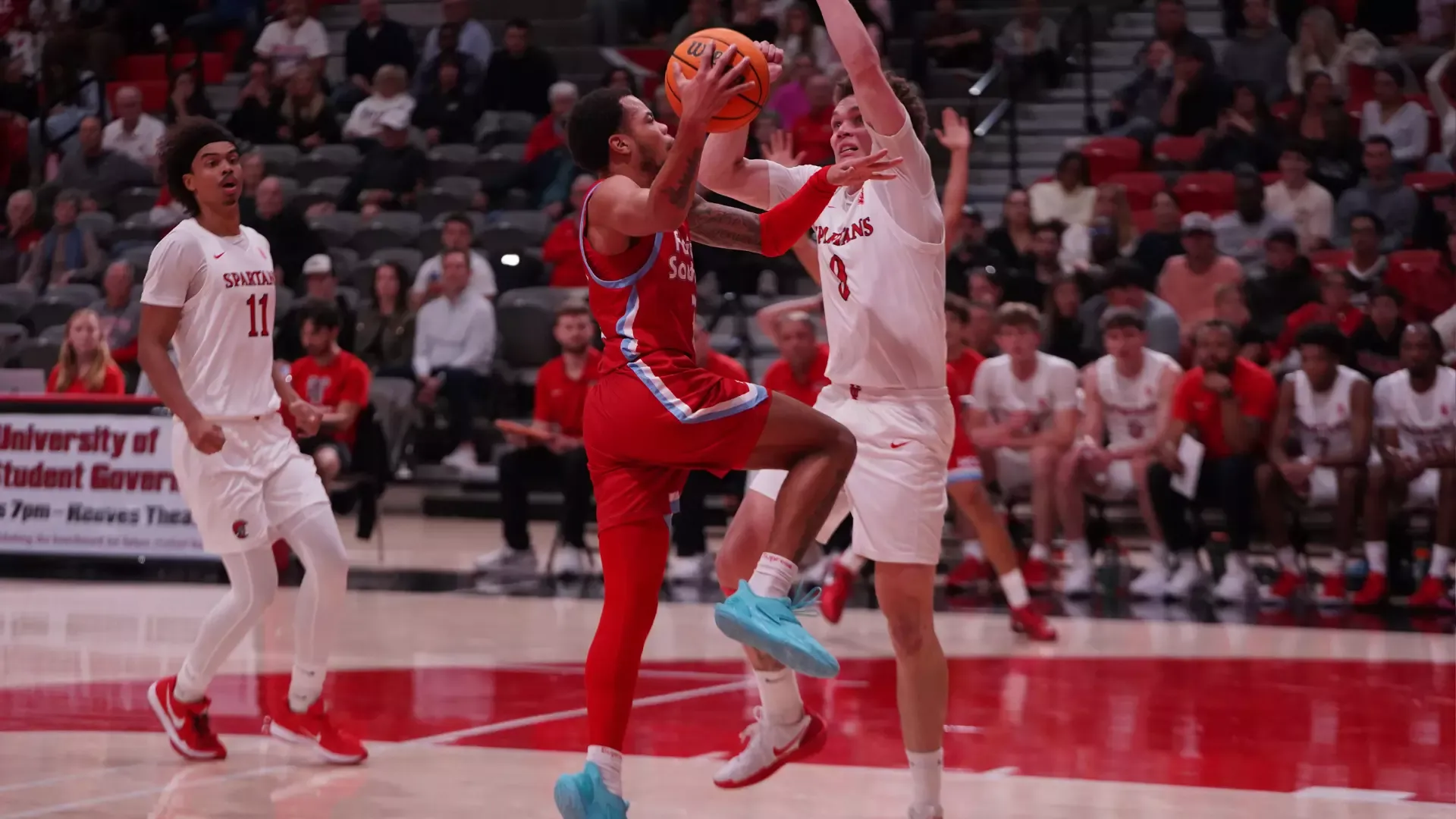 Jasir Tremble driving layup against Tampa