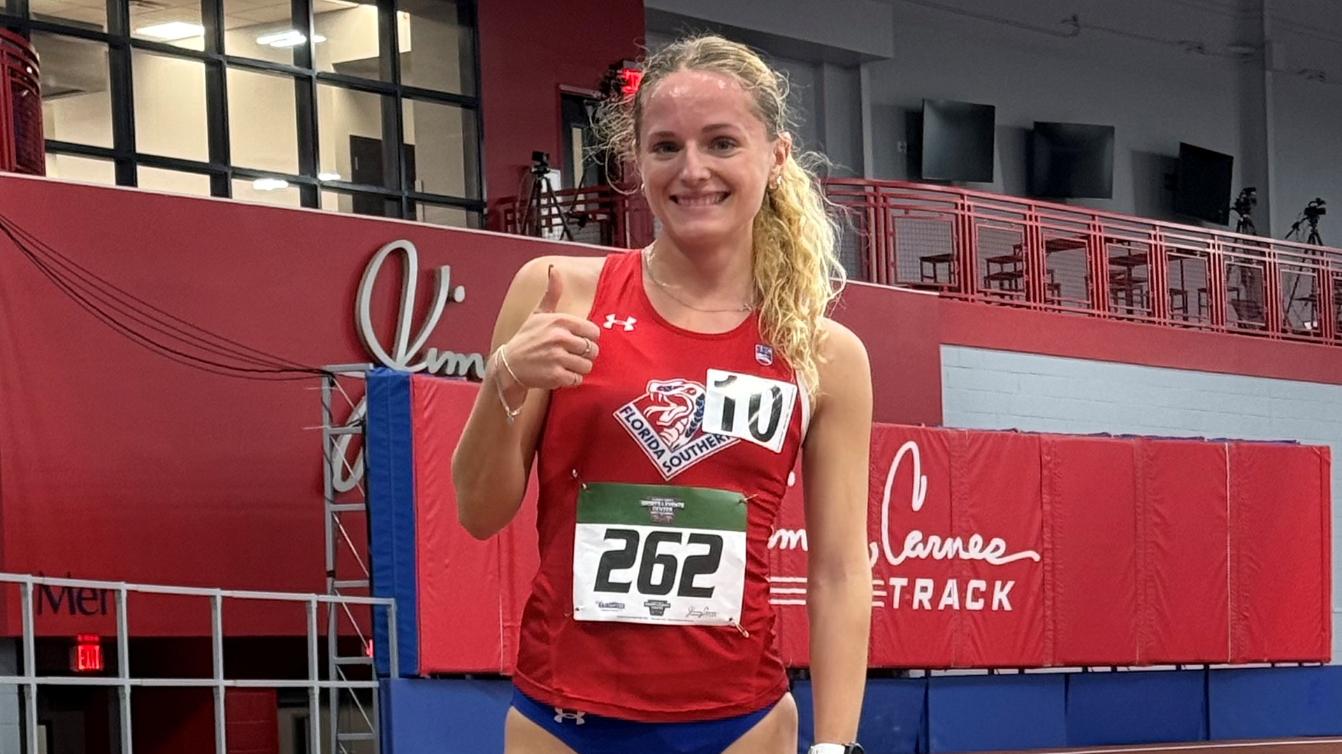 Grace Reed at the ACSEC Invitational after breaking 3,000m school record