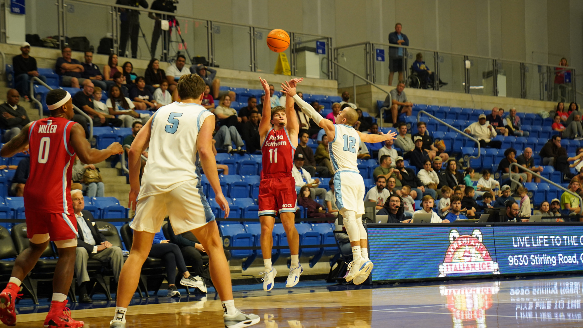 Brady Corso shoots a three against Nova Southeastern