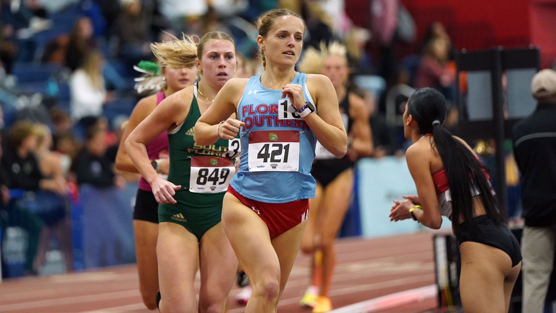 Grace Reed setting the new mile record for Florida Southern women's track at the Legends of Alachua County Invitational