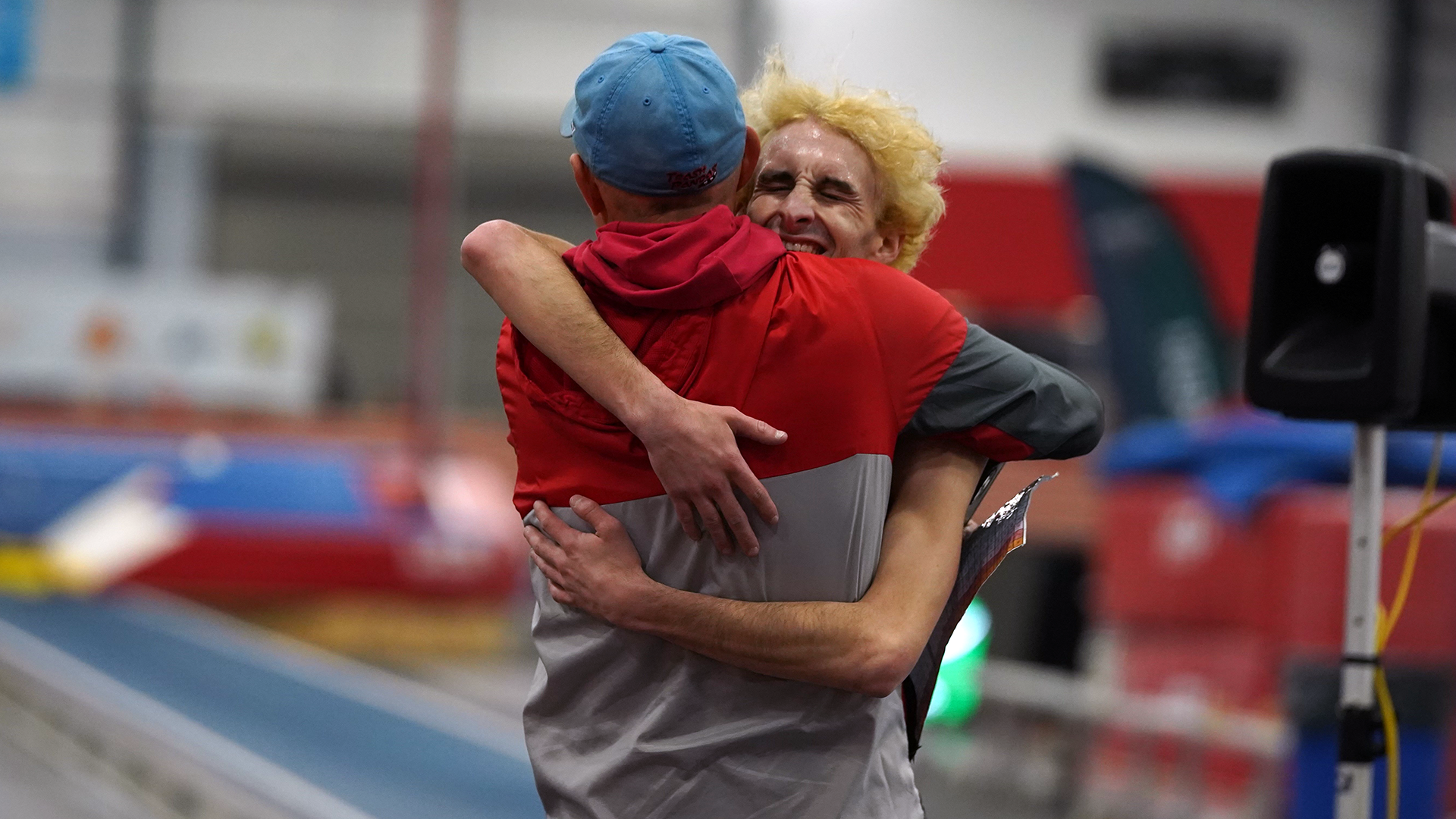 Michael Toppi hugs Head Coach Matt Levassiur