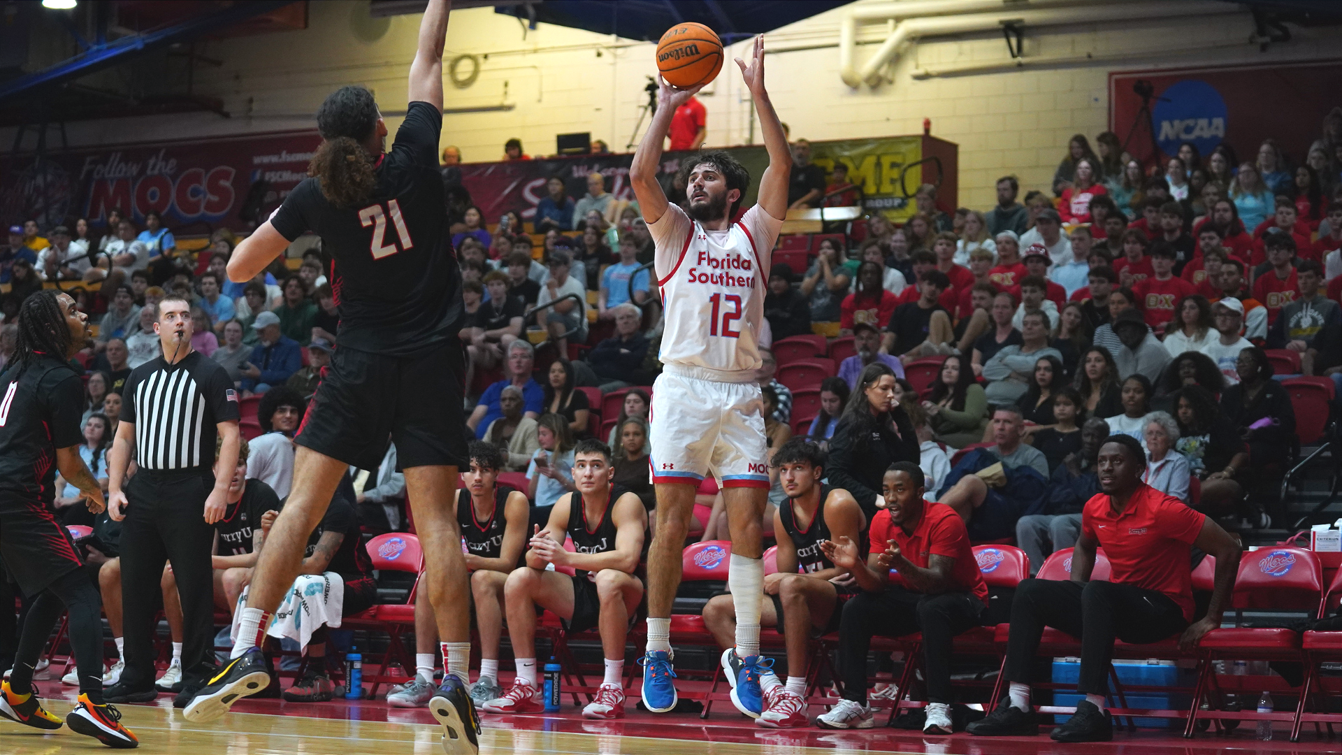 Buccino shoots a three against Barry