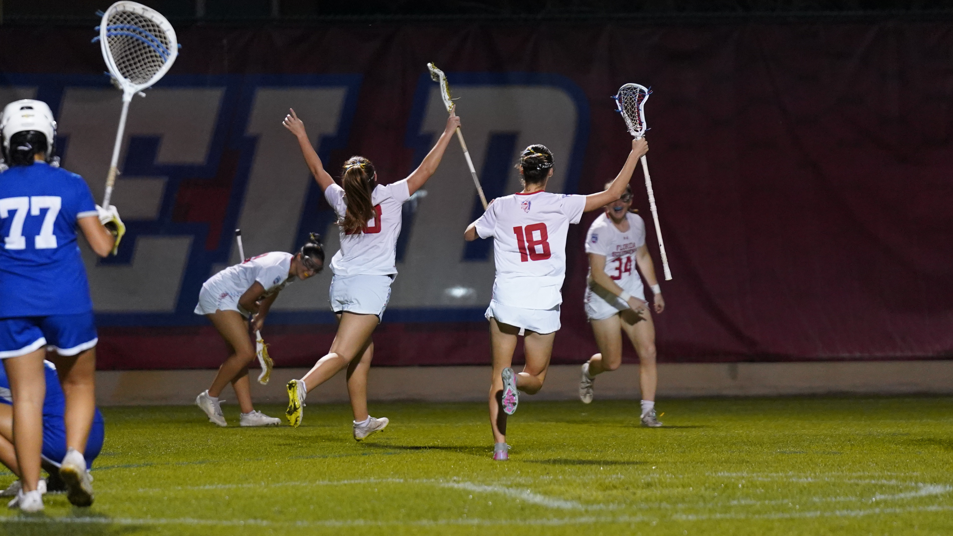 Rivera and Watson celebrate with Muma after first career goal