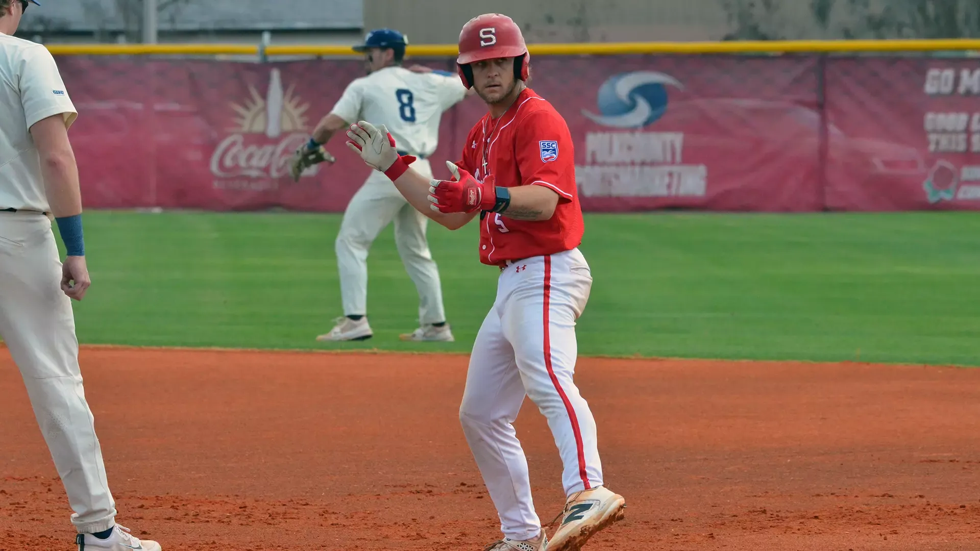 Ryan Jenkins celebrates a base hit versus UIS