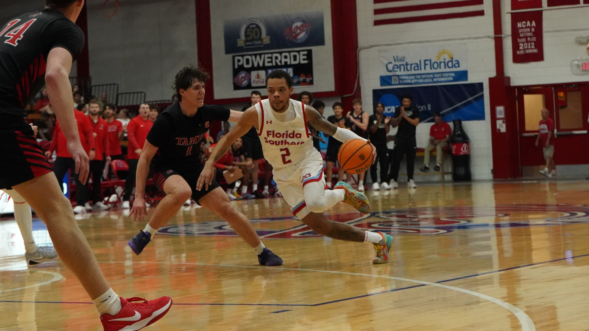 Jasir Tremble dribbling basketball