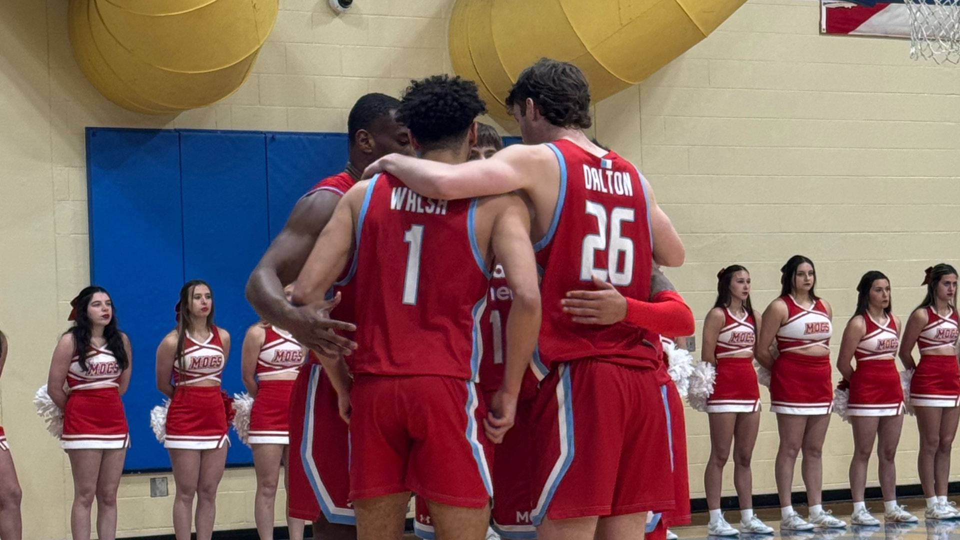 Men's basketball team huddle at Rollins