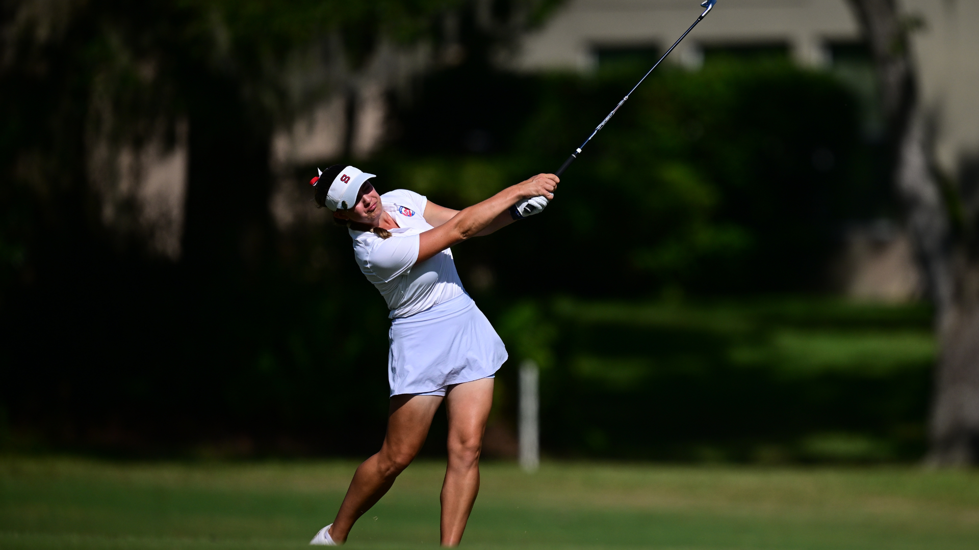 Clare Gimpel mid swing with an iron