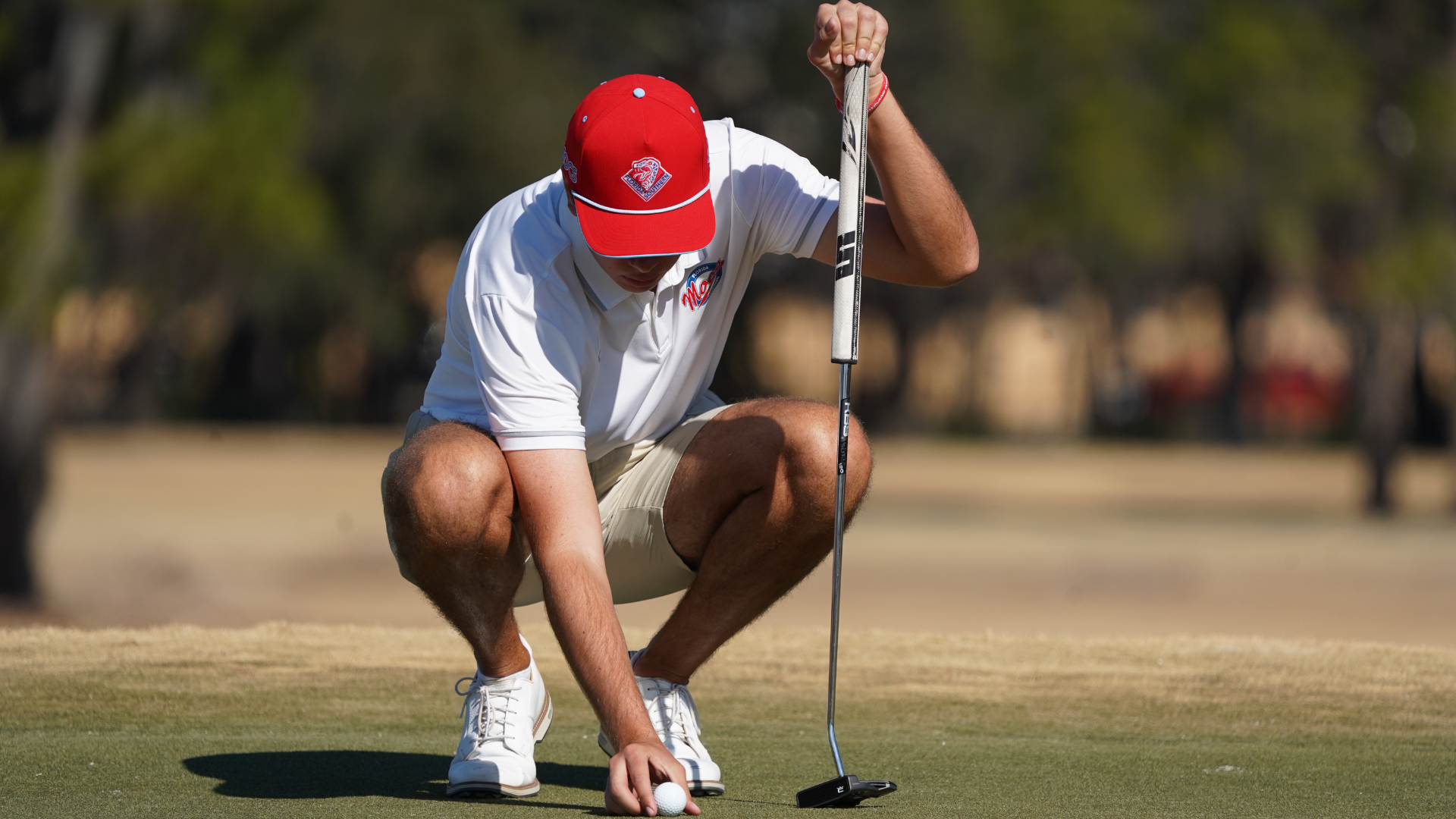 Max Barile lining up a putt