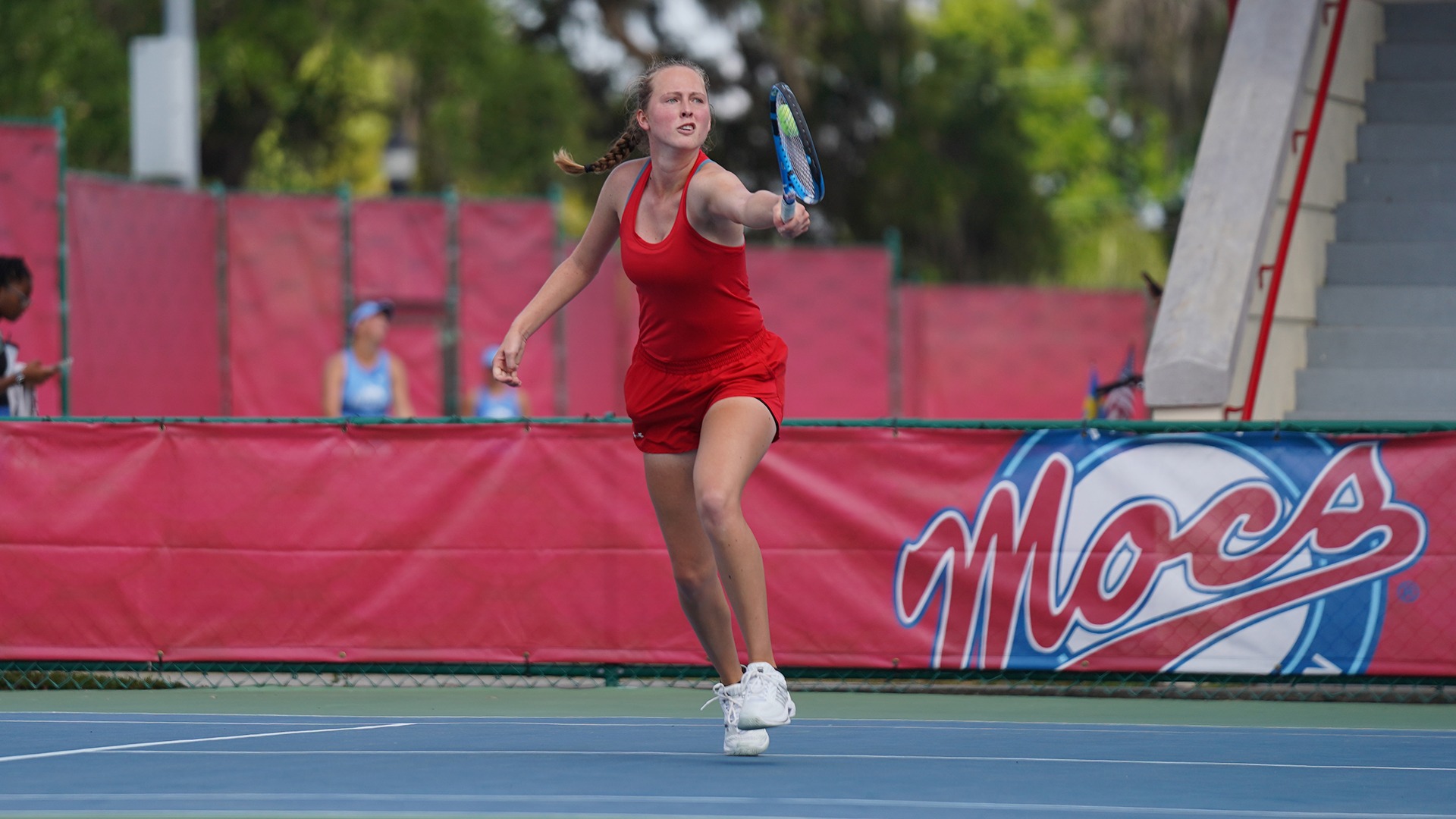 Women's Tennis Annika Berrendorf reaching for a tennis ball