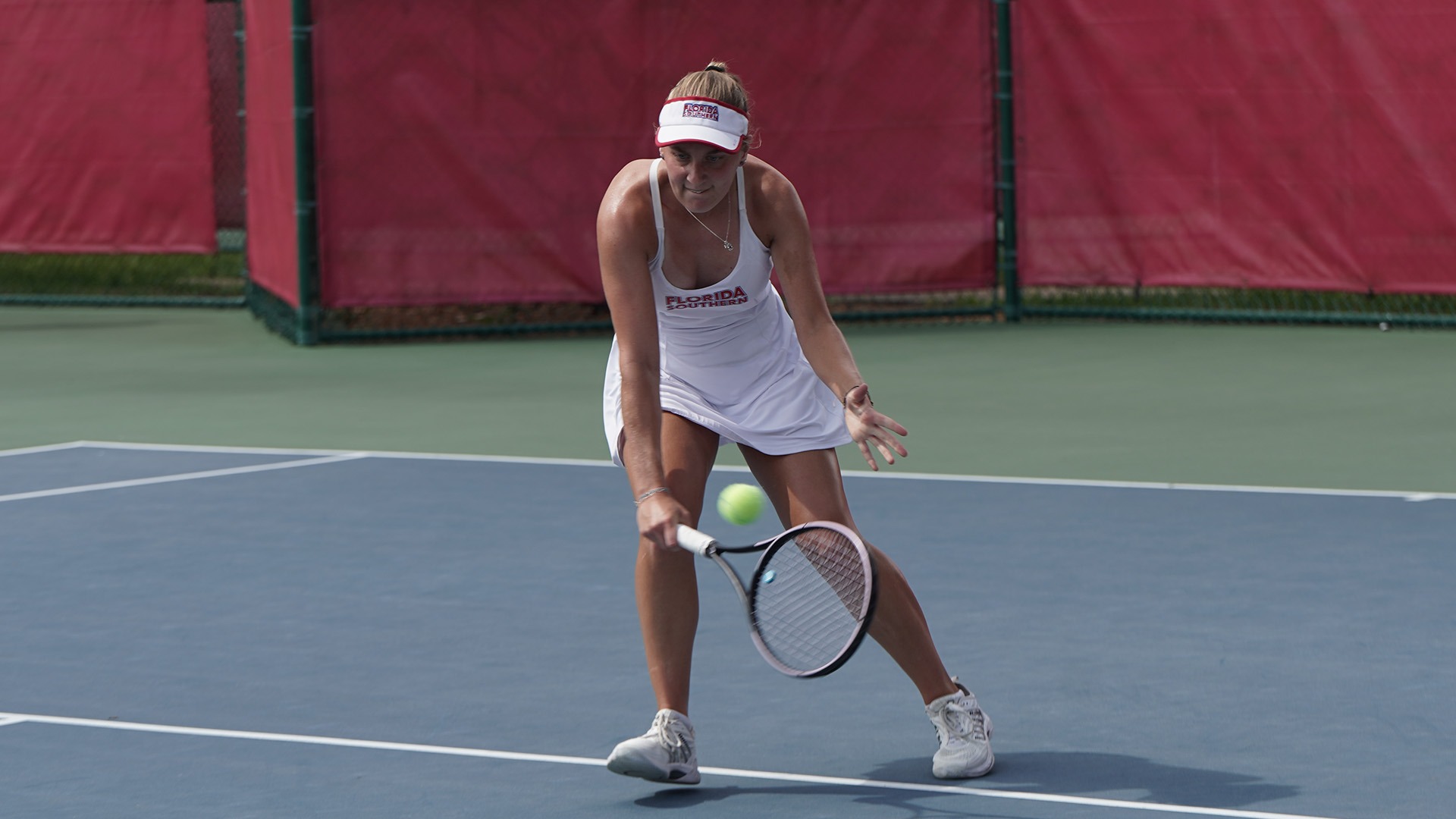 Josie Holderbach reaching for the ball 