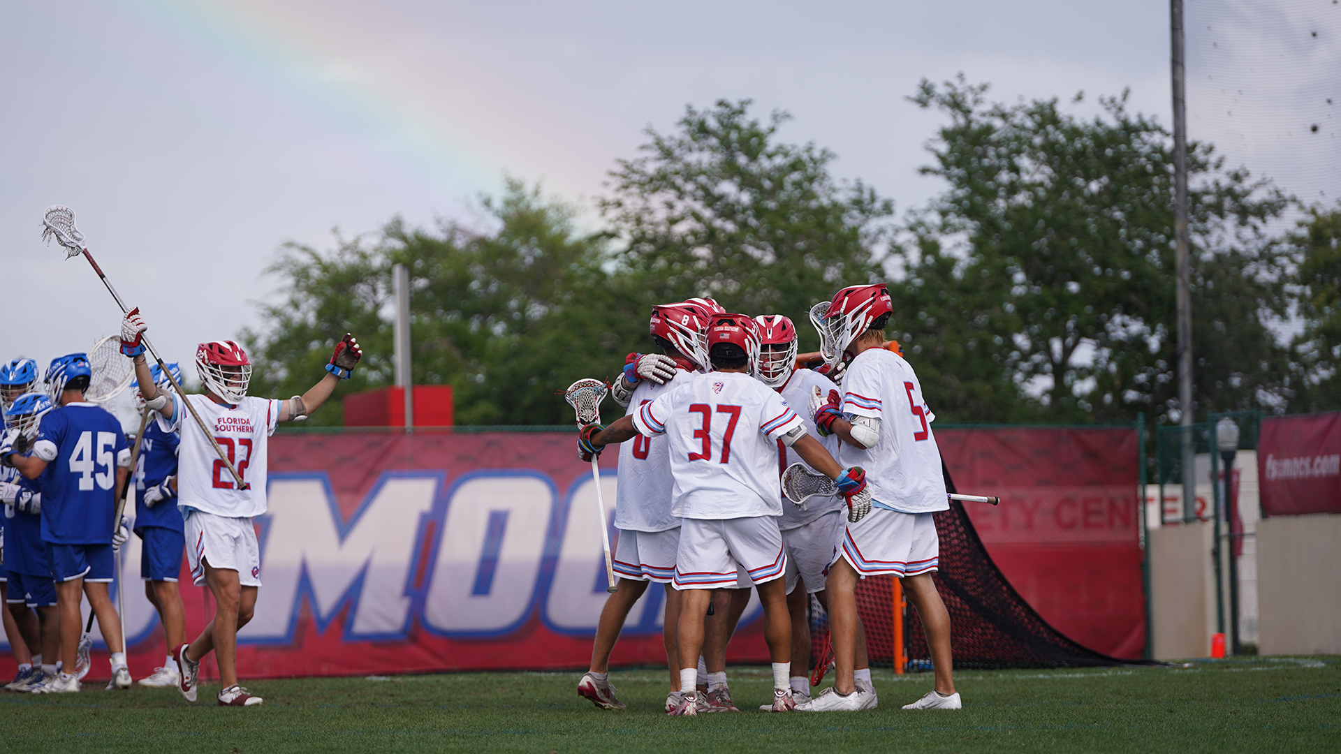 Men's Lacrosse celebrates a goal versus Lynn