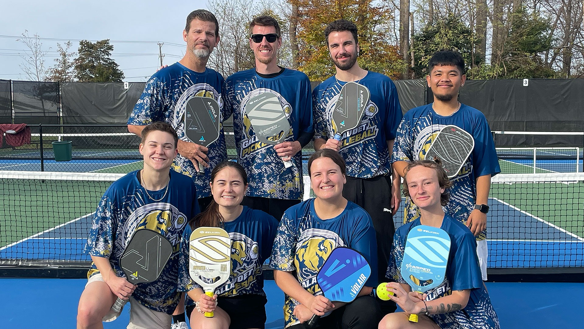 2024 Gallaudet University Pickleball Club Team Photo outside on a clear day on a pickleball court.